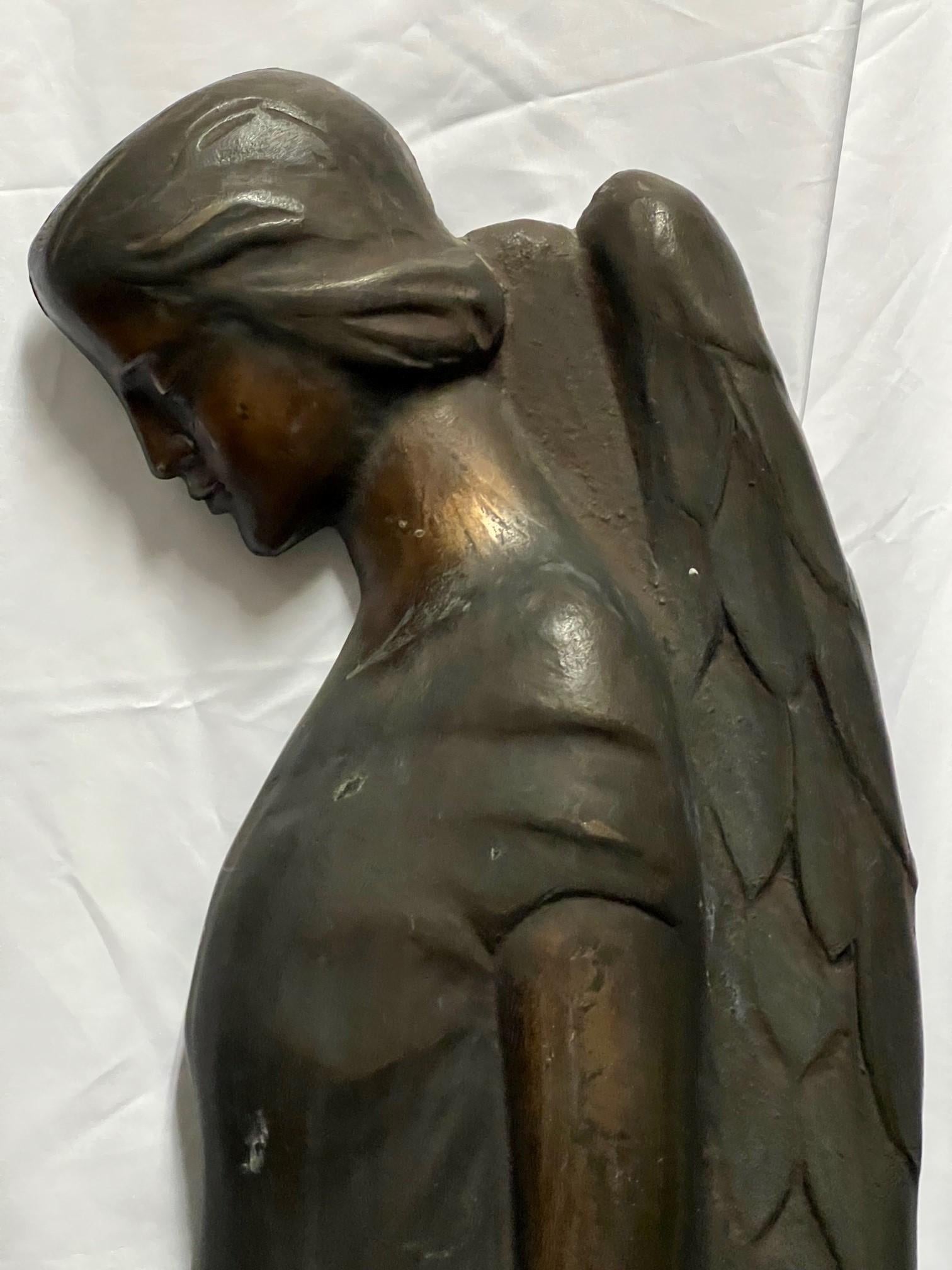 mourning angel statue