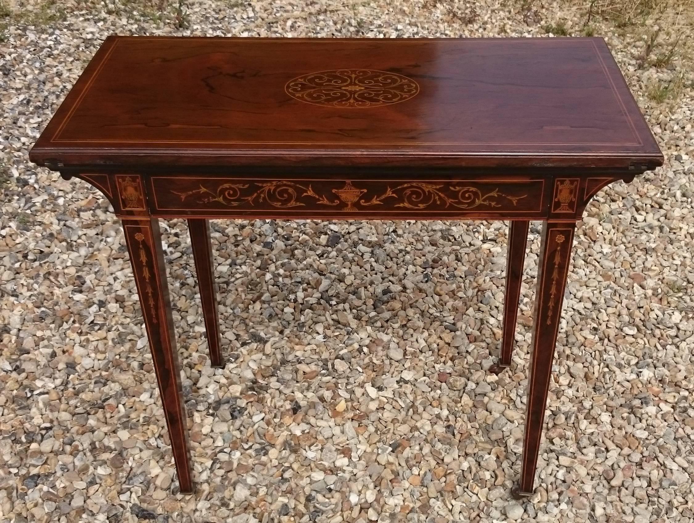 Very fine quality early 20th century antique card table with intricate box wood inlay. This card table is very well made, the construction methods and choice of timber are second to none and the inlay is very detailed. The top rotates through ninety