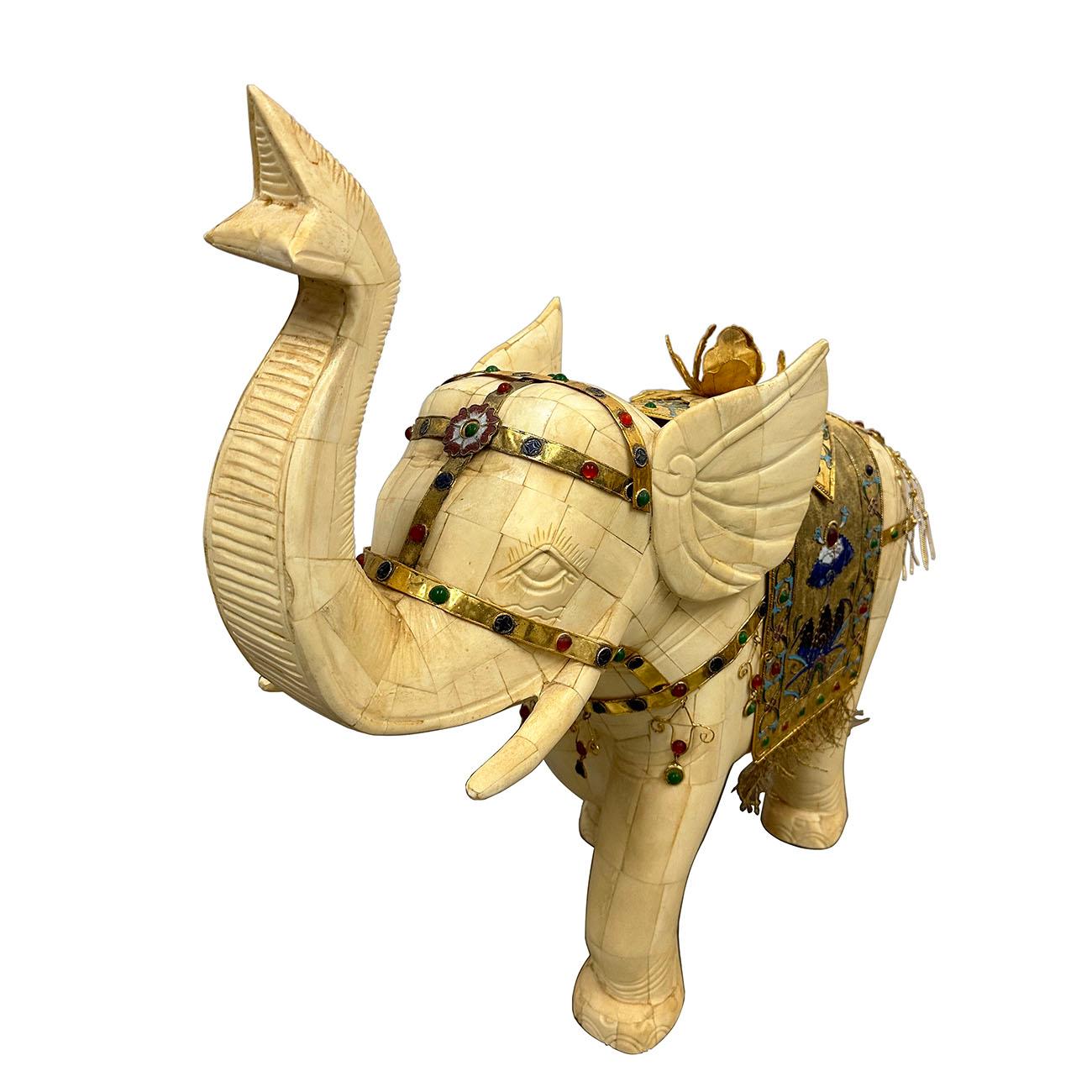 This magnificent antique Chinese bone carved elephant was 100% hand made and hand carved from OX bone. It has very detailed carving works on it. The rug on the elephant back was made from copper thread (AKA golden thread in Chinese) and decorated by