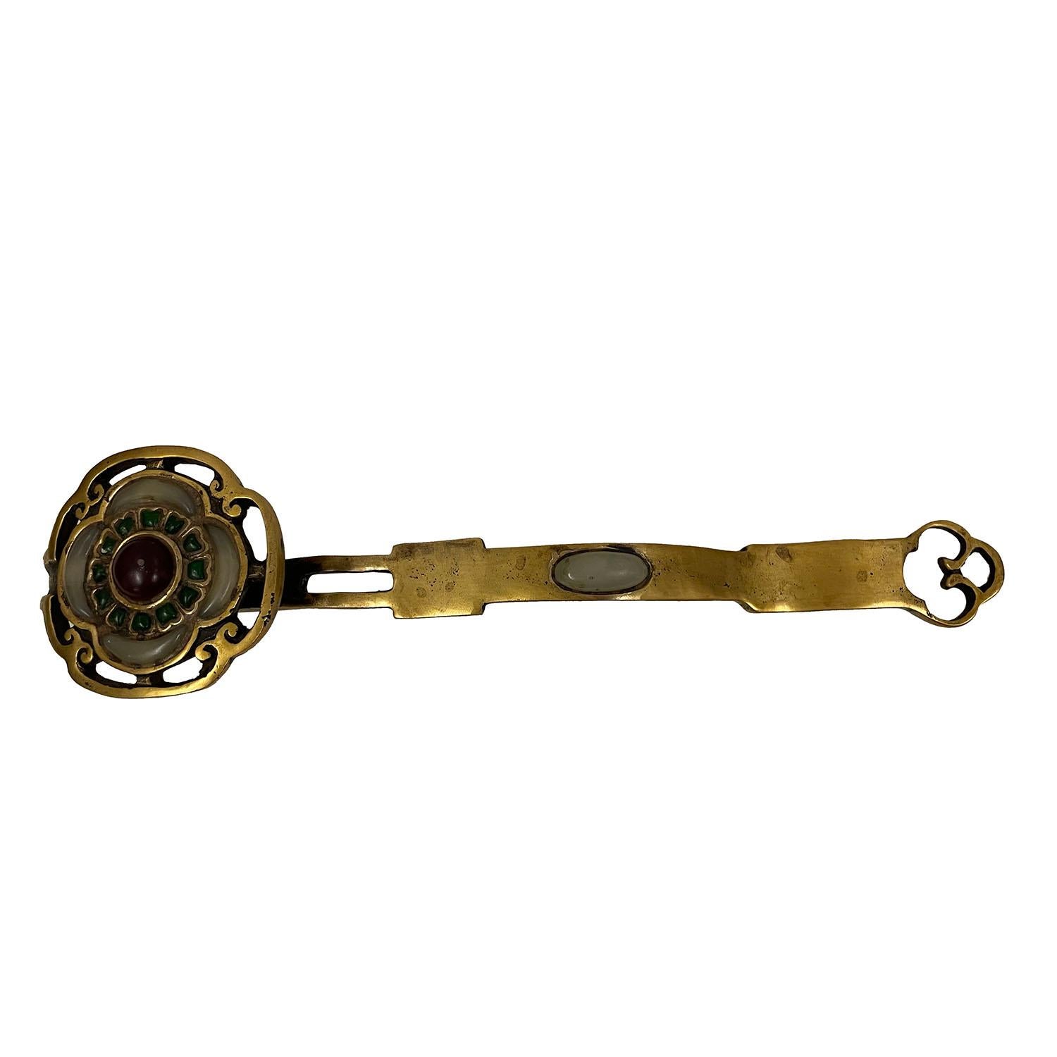 Look at this magnificent Chinese Bronze Ruyi. It shows very detailed handcraft works on it. It is all handmade and hand-carved jade inlay Ruyi. Ruyi is a curved decorative object that serves as either a ceremonial scepter in Chinese Buddhism or a