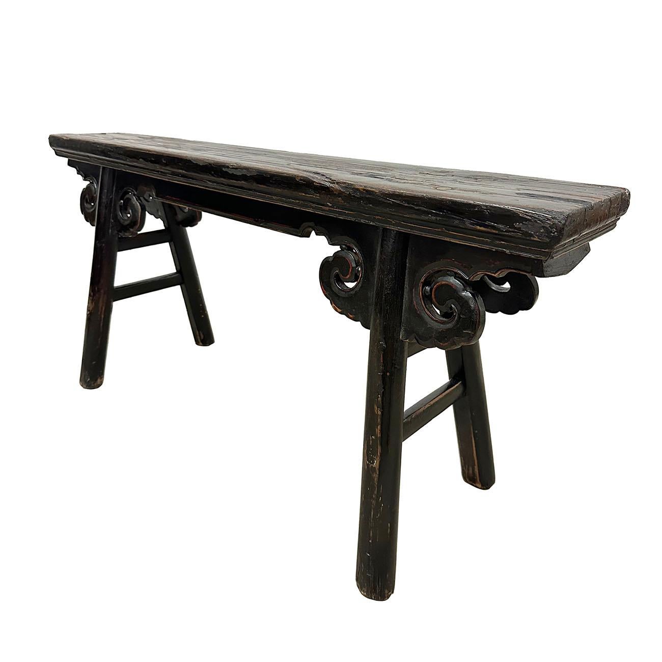 This Chinese antique country bench that you can use it as a coffee table. This bench was a classic design and elegant with some simple carving and solid construction. Black lacquer finished. Smooth to touch. A lot of patina. It was used everywhere