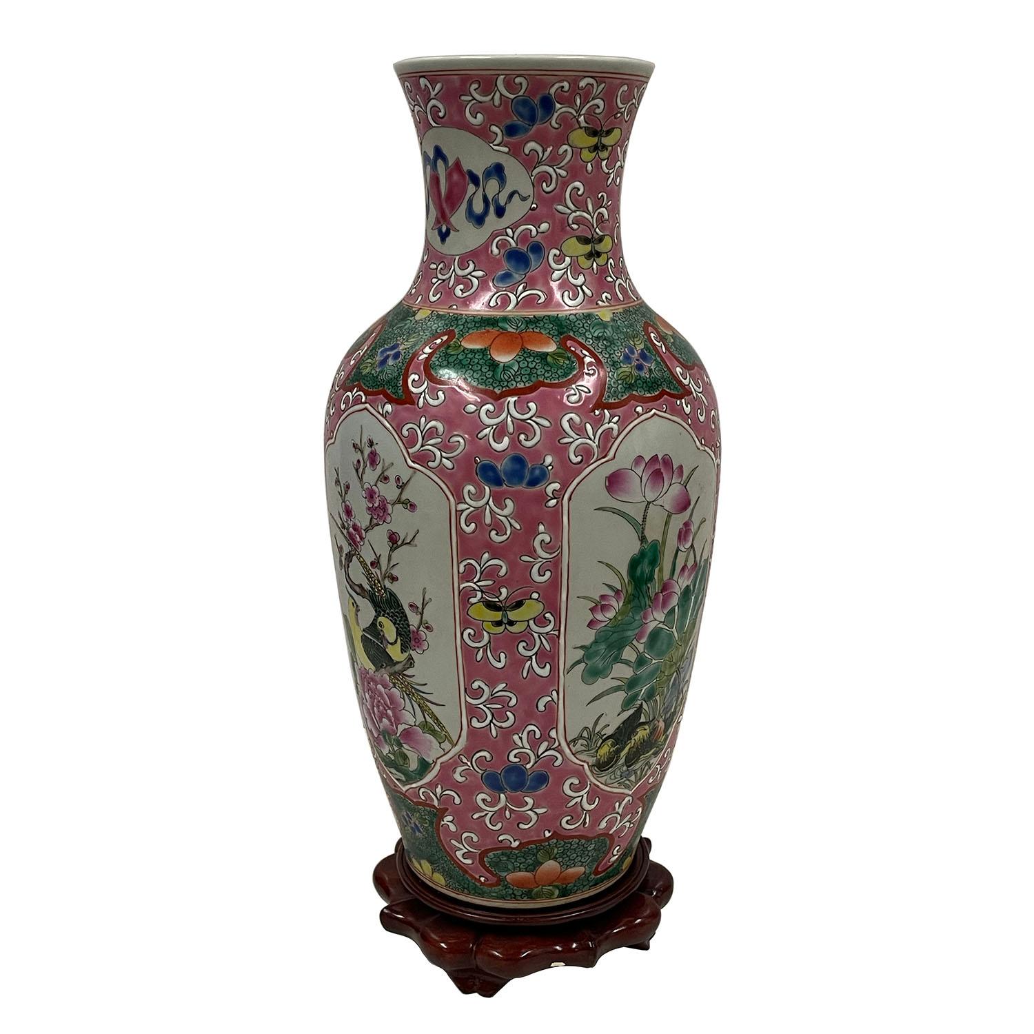 Look at this magnificent Chinese Famille Rose vases. It was hand made and hand painted in about 1850 - 1900 in a civilian kiln. It has hand painted Chinese traditional folks arts of floral and birds, etc all around the vase. Look at the pictures, it