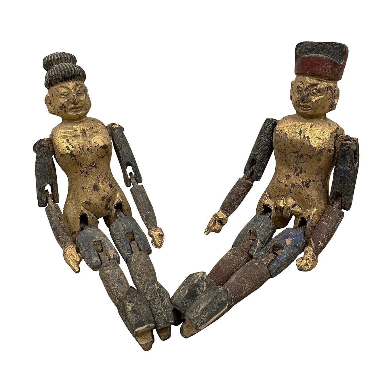 Rare find antique Chinese gilt wooden carved adult toys. It is 100 percent hand made hand carved from Camphor wood with gilt painting on it. They are the couple of a man and a women. The joint of the arms and legs of this pair of toys are movable.