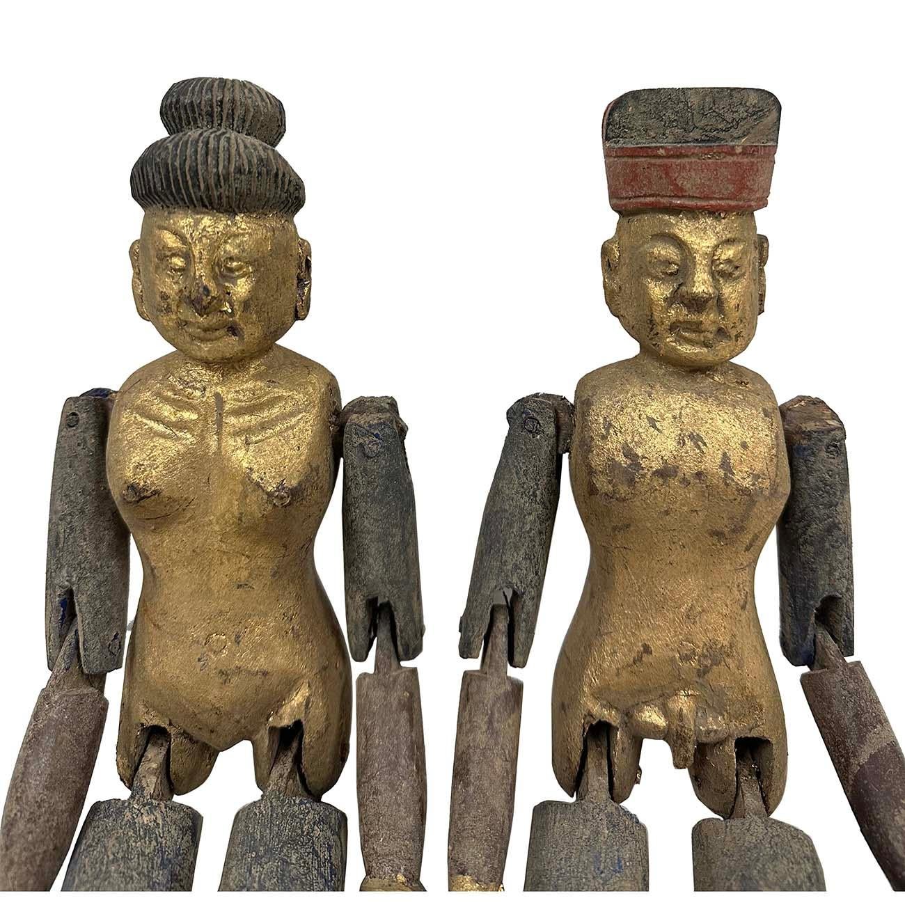 Rare find antique Chinese gilt wooden carved adult toys. It is 100 percent hand made hand carved from Camphor wood with gilt painting on it. They are the couple of a man and a women. The joint of the arms and legs of this pair of toys are movable.