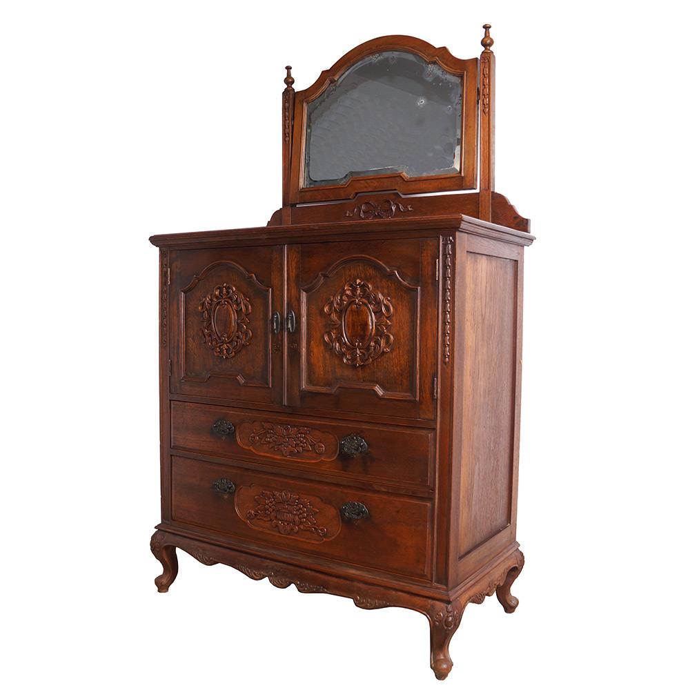 This antique raise carved dresser was made from solid Teak wood. It was very popular in Shanghai, China during 1920 to 1940's. There are lot of deep/raised carving works on the doors and drawers with beautiful curved feet on all four legs. Inside