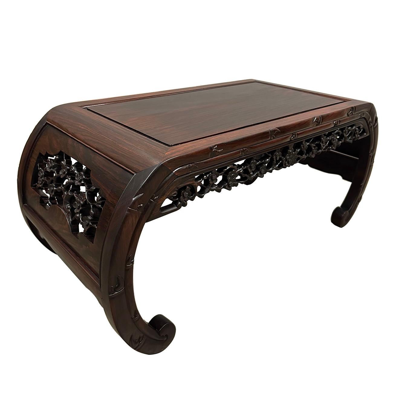 

This beautiful carved Coffee Table is made from solid Rosewood with some traditional Chinese carving works all around four sides with banana legs. It has intricate carving works of cherry blossom on four sides of the table. Look at the pictures,
