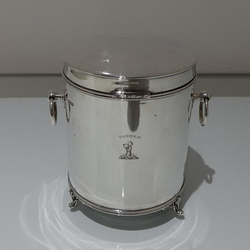 A very sweet and extremely desirable drum shaped silver biscuit box with two elegant drop ring handles. The lid of the box is hinged and the centre front has a stylish contemporary crest for importance.

 

Weight: 16.26 troy ounces/506