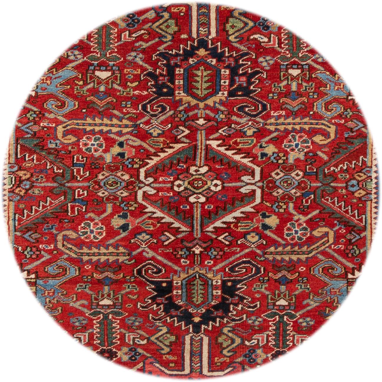 Beautiful hand knotted vintage Heriz wool rug. This rug has a red field and black border with multicolored accents in all-over floral design,

circa 1920

This rug measures 7' 0