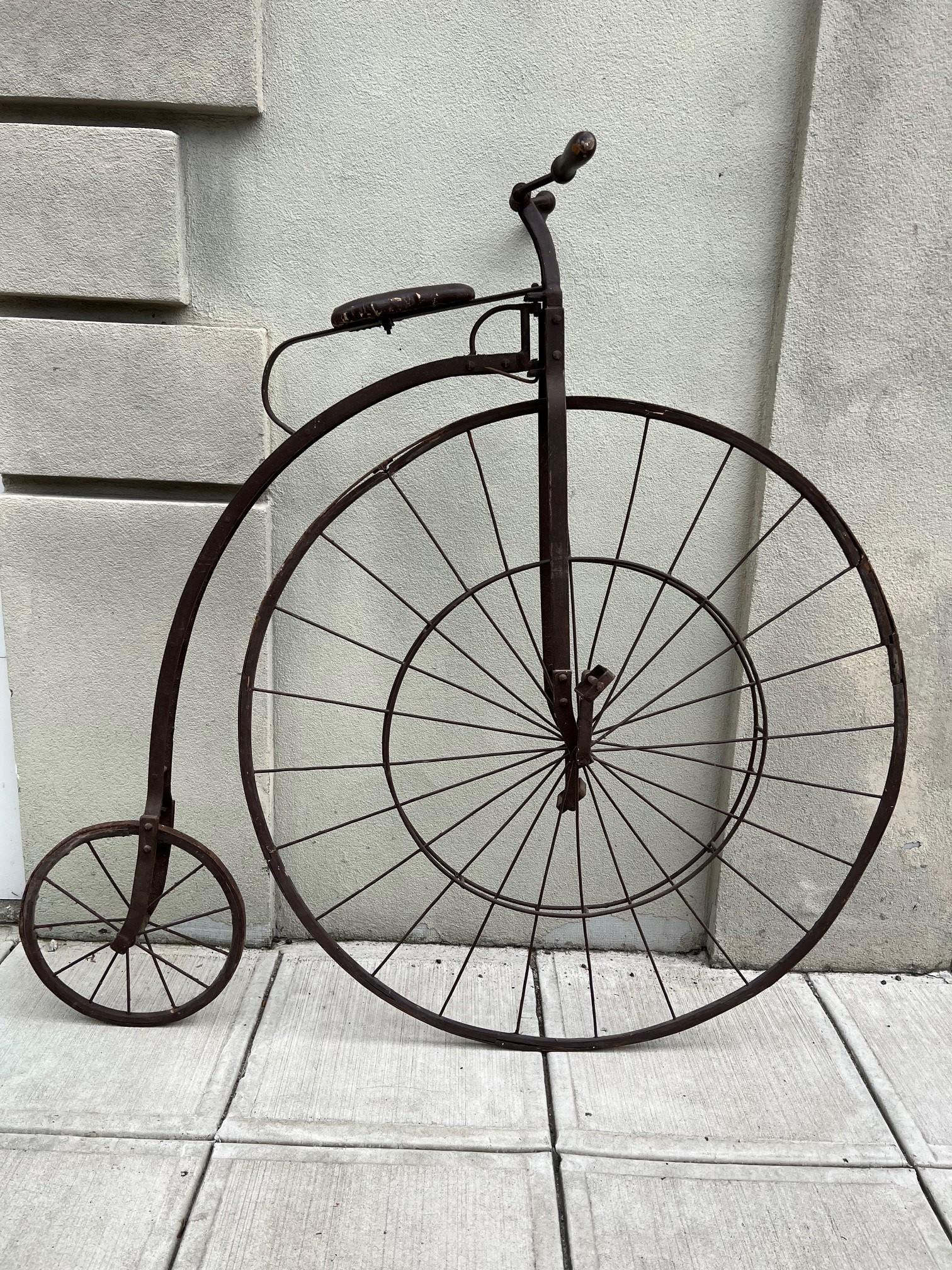Fabulous high wheeler bicycle, I believe from the Early 20th century circa 1920s. It seems to be a size smaller than a Penny Farthing and larger than a child high wheeler. Sorry I wish I had more information, I purchased it from a small estate in