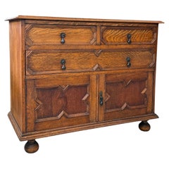 Early 20th Century Antique Jacobean Style English Cabinet with Oak Construction