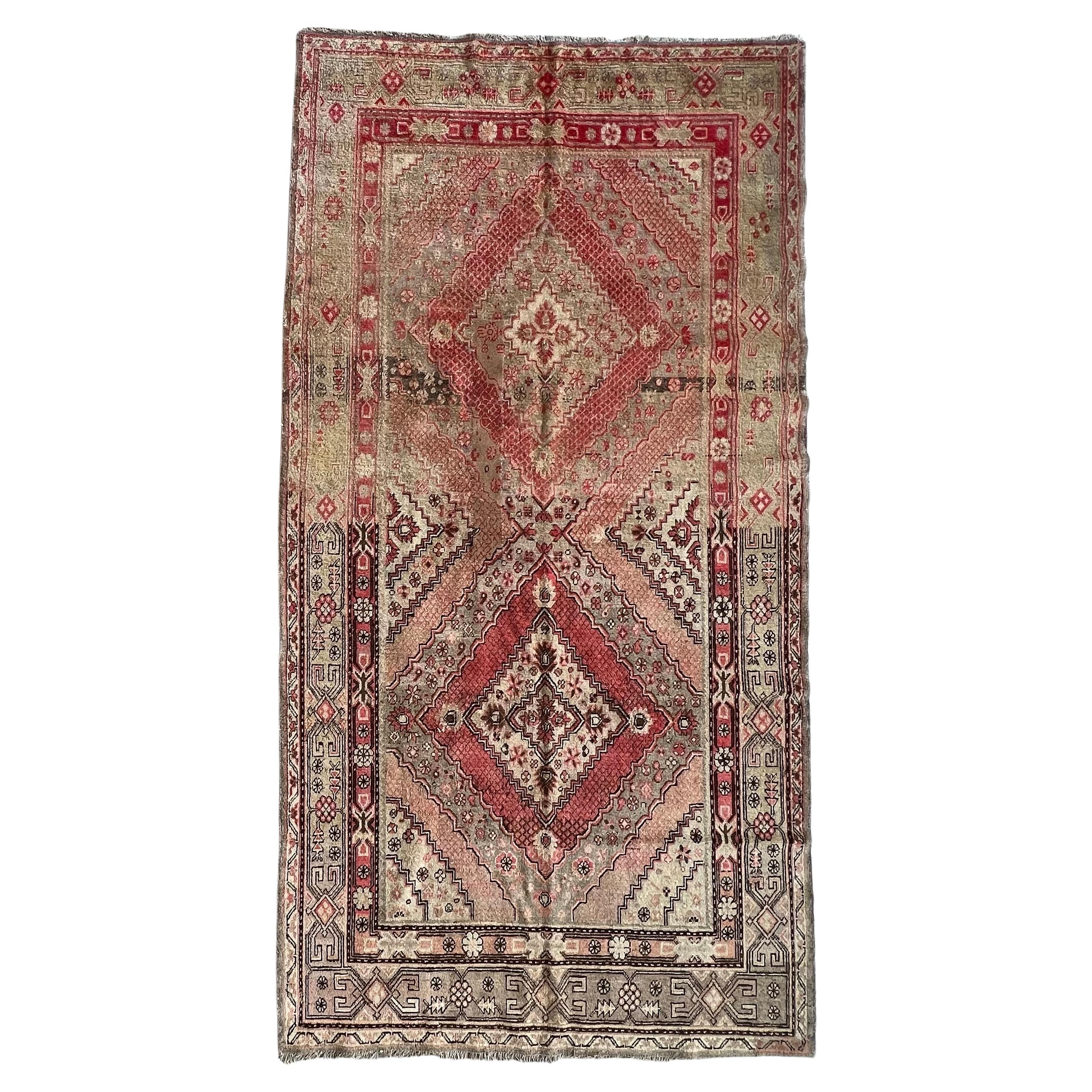 Early 20th Century Antique Khotan Hand Knotted Wool Rug, with Pink Abrash, 1910 For Sale