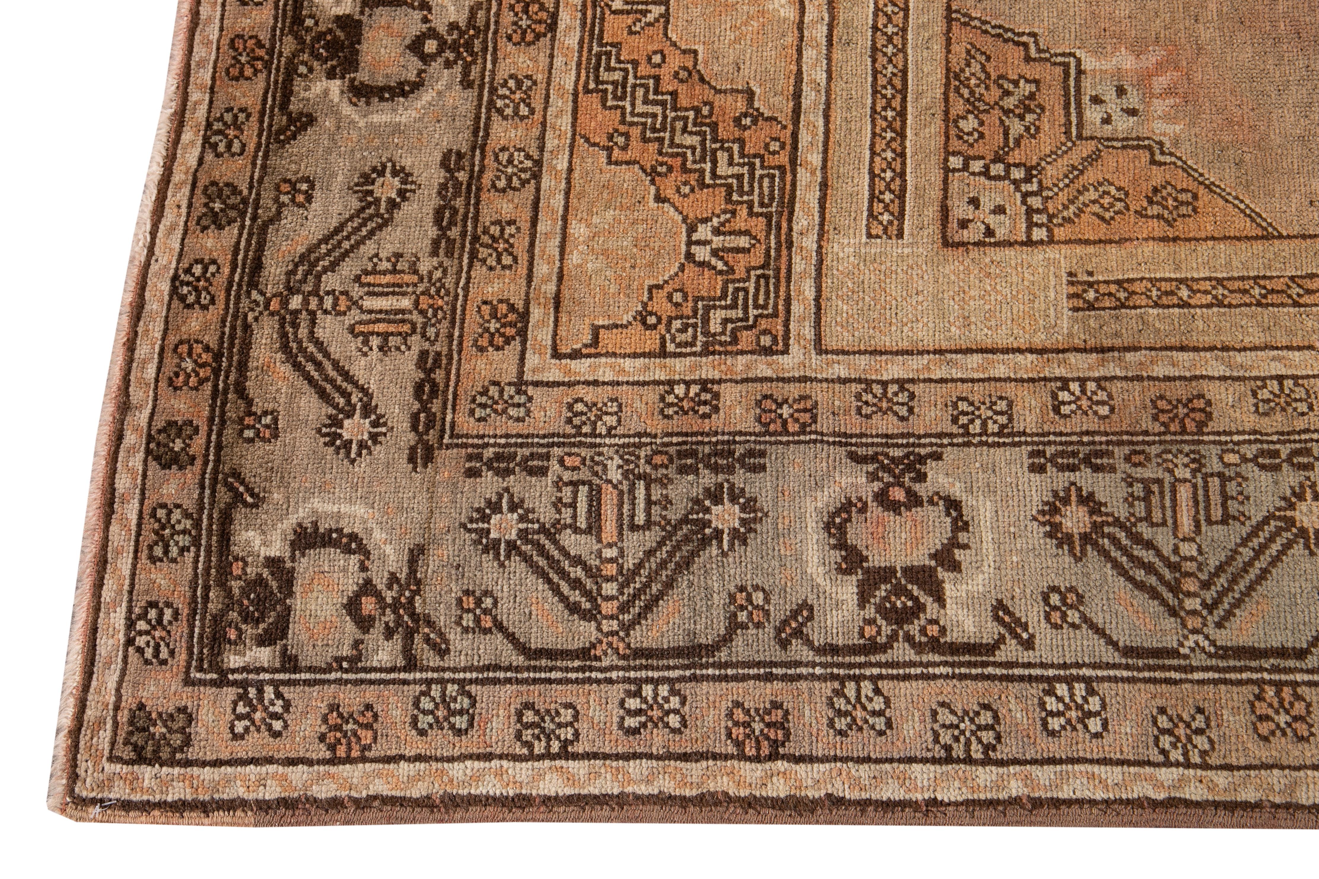 Turkestan 20th Century Antique Handmade Khotan Wool Rug With Orange Rust Color Field  For Sale