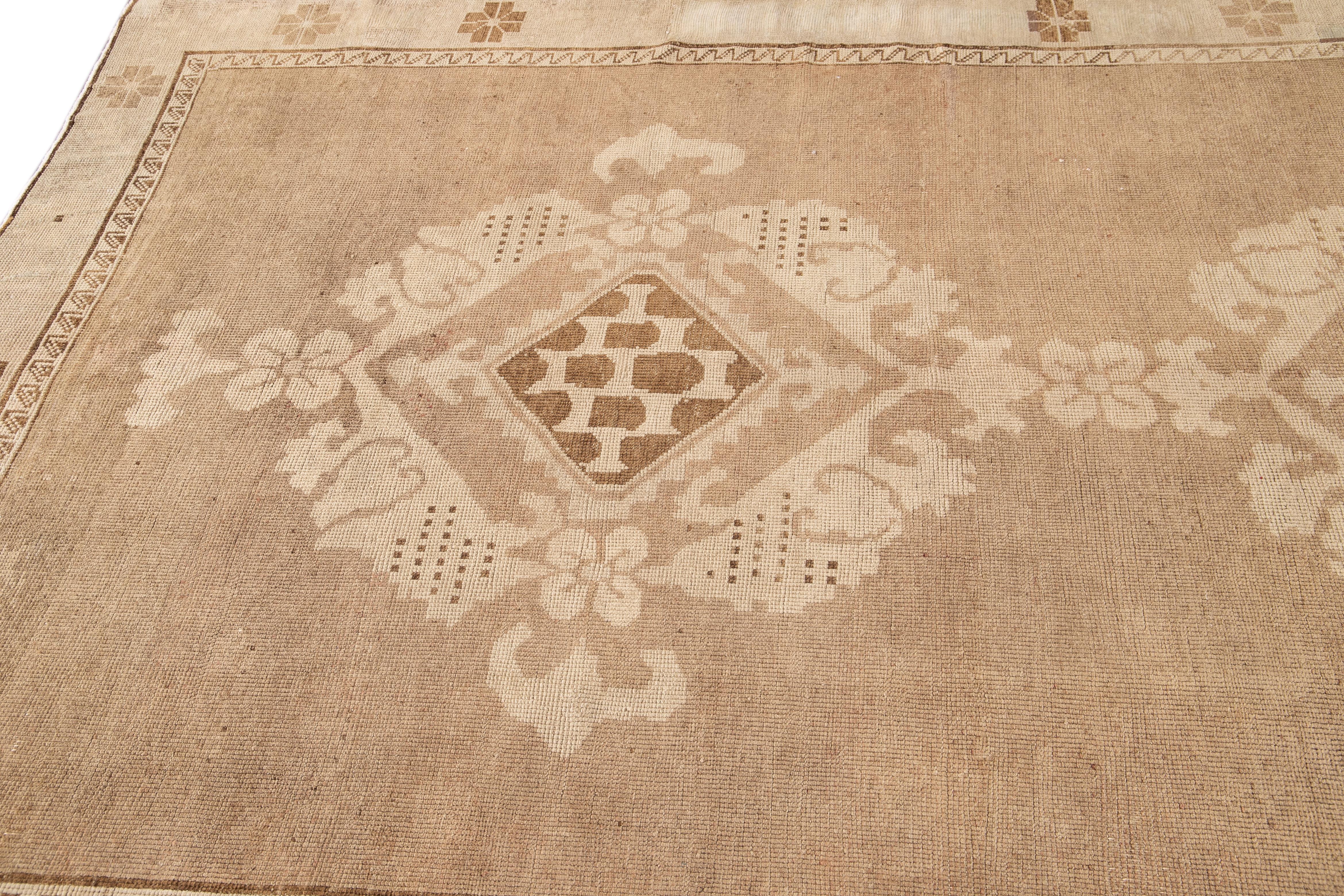 Early 20th Century Brown Antique Khotan Wool Rug with Medallion Design For Sale 2