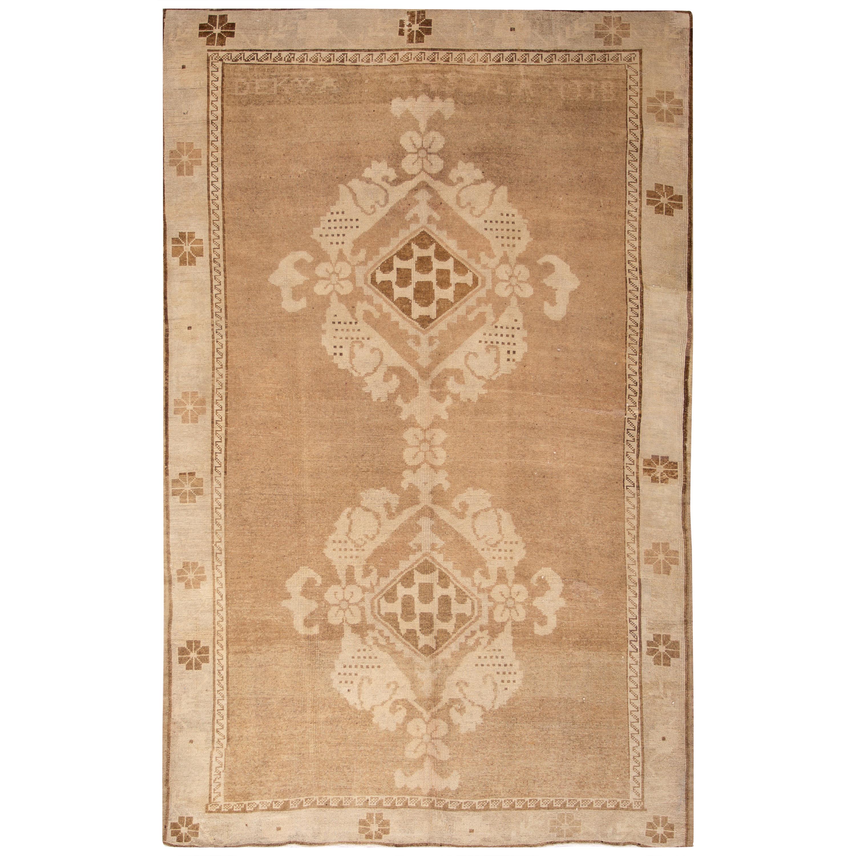 Early 20th Century Brown Antique Khotan Wool Rug with Medallion Design