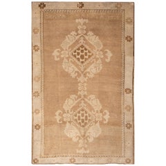 Début du 20e siècle - Tapis ancien en laine Khotan marron à motifs de médaillons