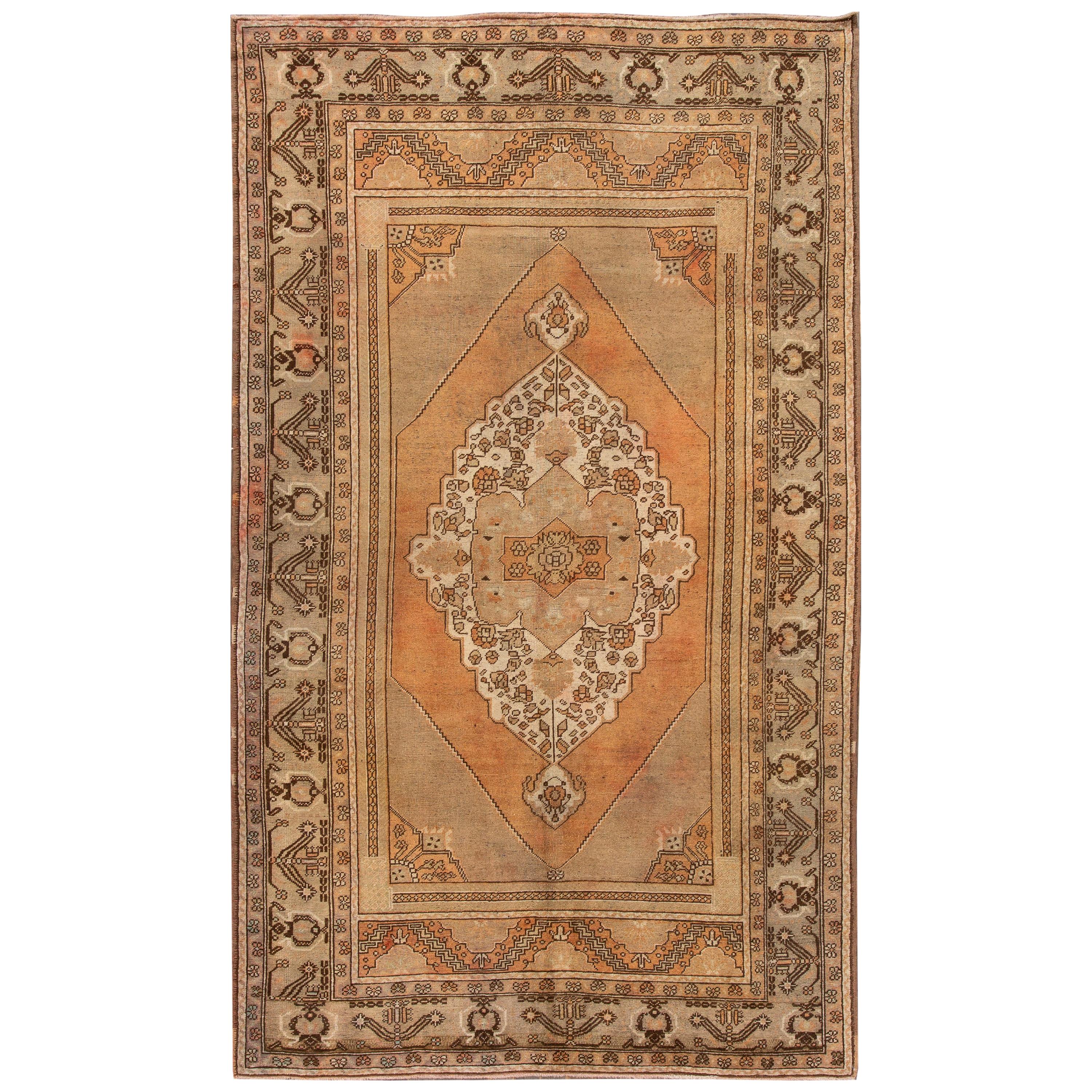 20th Century Antique Handmade Khotan Wool Rug With Orange Rust Color Field  For Sale