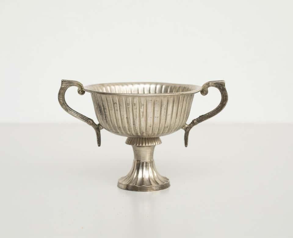 Early 20th century metal chalice  by unknown manufacturer, Spain.    In original condition, with minor wear consistent with age and use, preserving a beautiful patina.    Materials:  Metal    Dimensions:  H 12.5 cm  W 19.5  D 14.5.