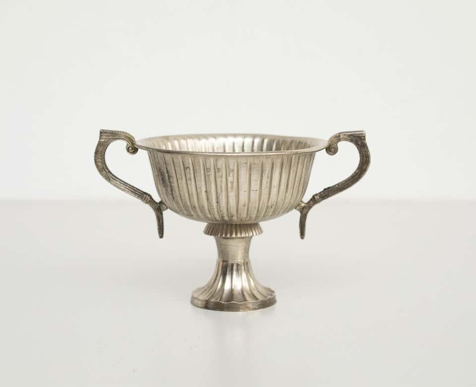 Early 20th century metal chalice
by unknown manufacturer, Spain.

In original condition, with minor wear consistent with age and use, preserving a beautiful patina.

Materials:
Metal

Dimensions:
H 12.5 cm
W 19.5
D 14.5.