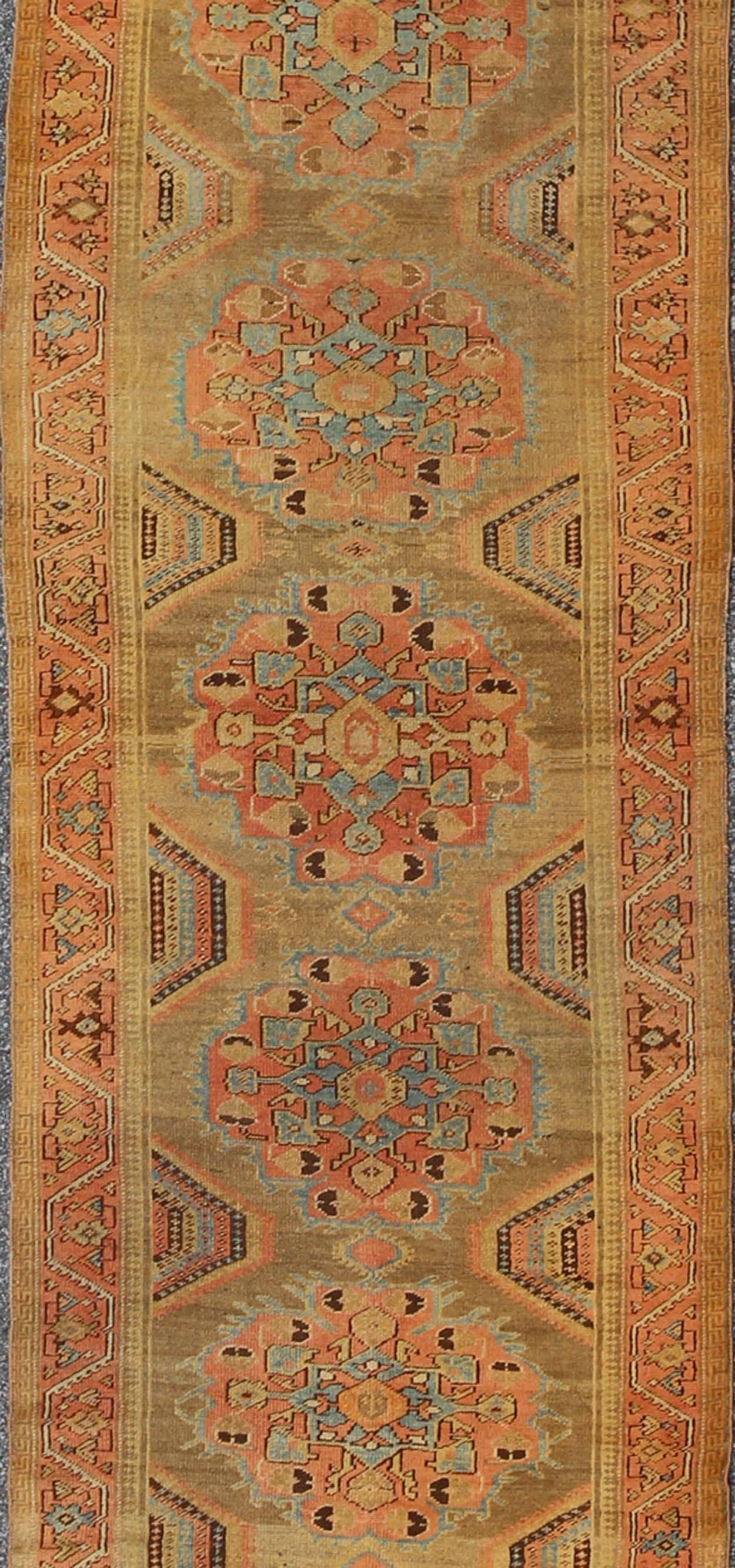 Turkish Early 20th Century Antique Oushak Runner with Medallions in Sand, Pink and Blue For Sale