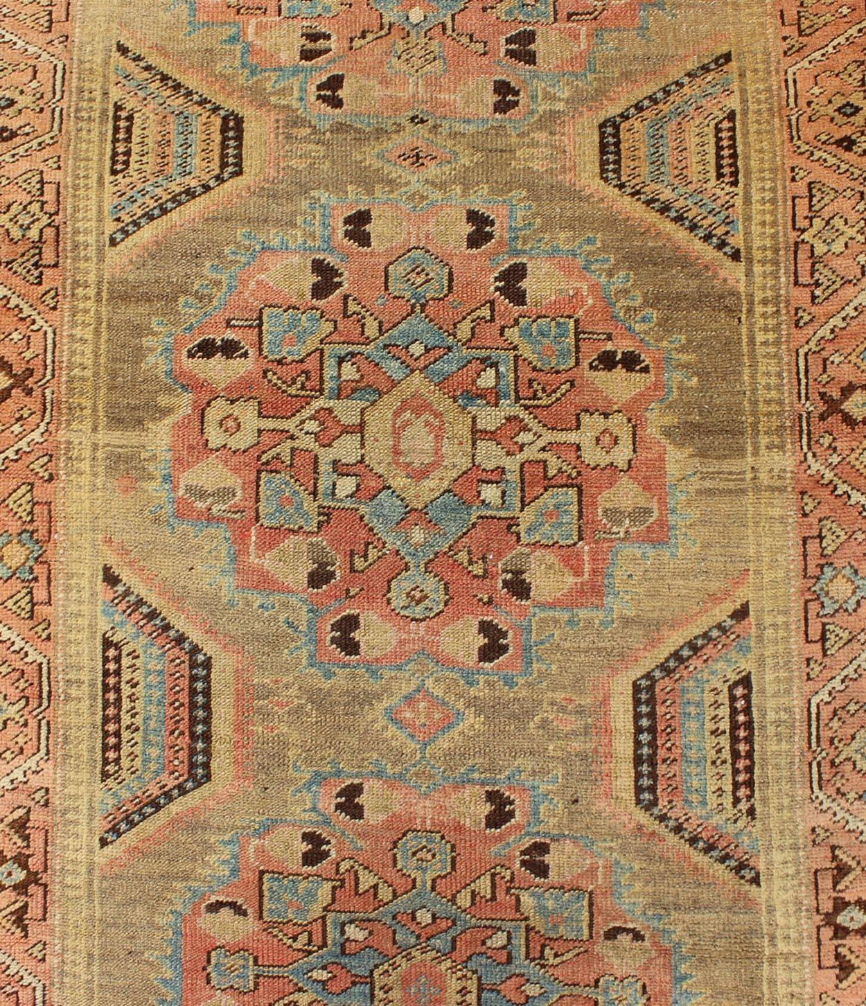 Wool Early 20th Century Antique Oushak Runner with Medallions in Sand, Pink and Blue For Sale