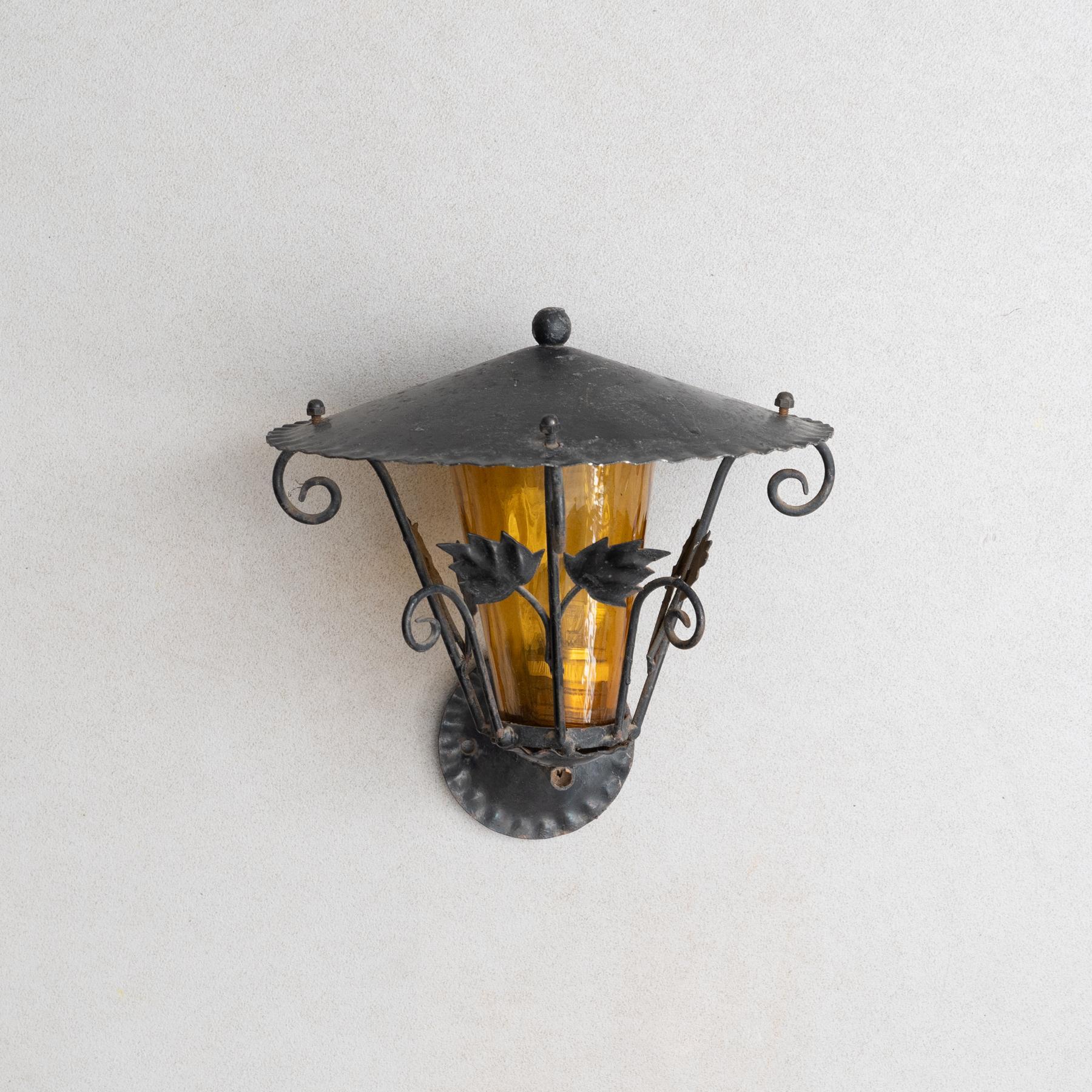 Early 20th century antique outdoors garden wall lamp.    By unknown manufacturer, France.    In original condition, with minor wear consistent with age and use, preserving a beautiful patina.    Not electrified.    Materials:  Metal.     