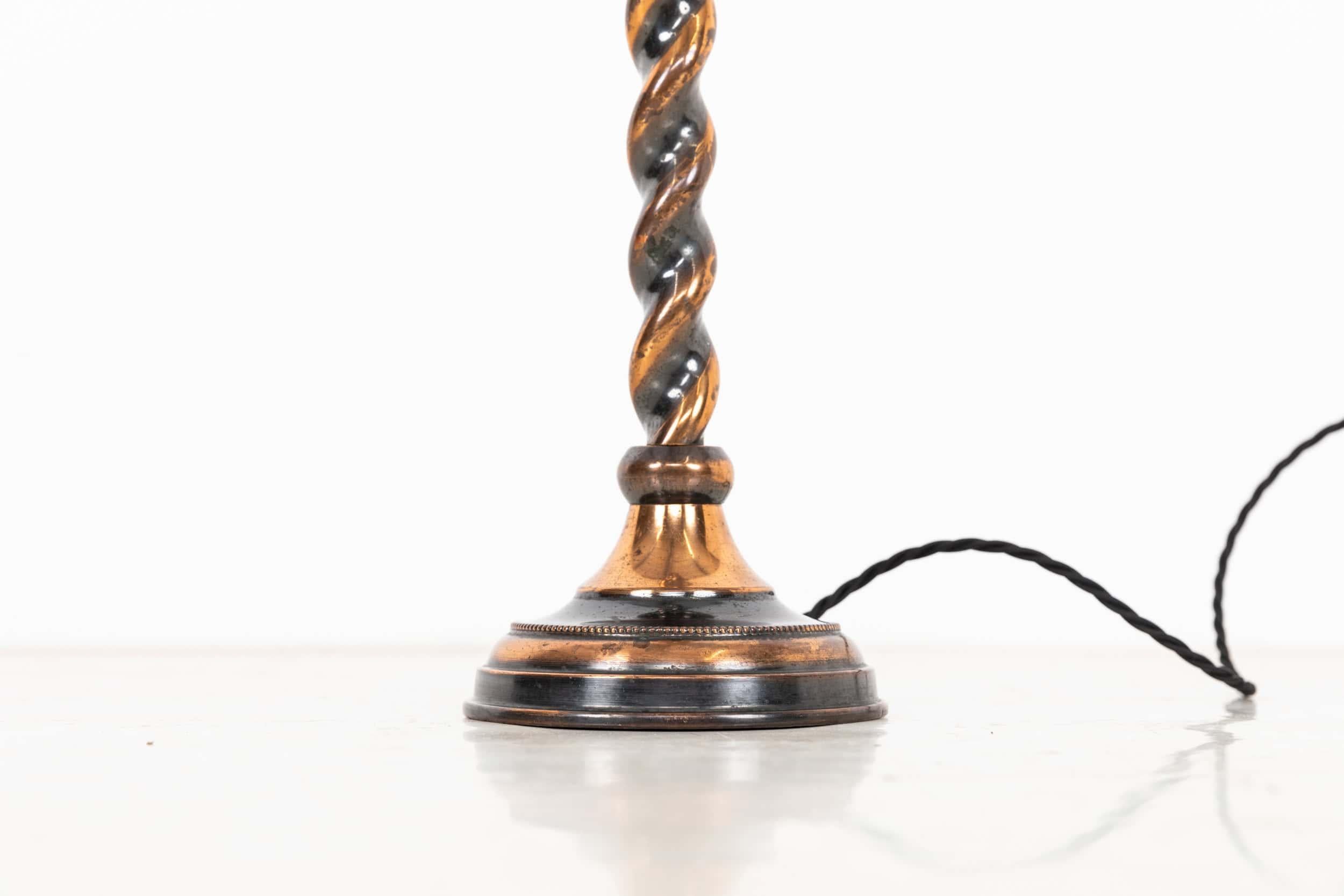 A superb copper table lamp made in England by GEC. c.1930

Crafted from brass with the original oxidised copper finish in wonderful condition, featuring a barley twist design to the stem.

Rewired with 2m of black twist flex and BS 3-pin plug.