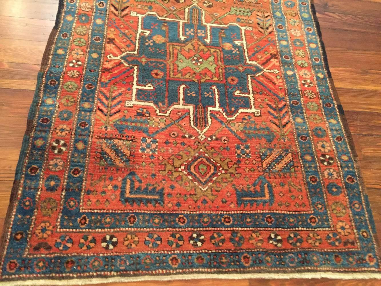 An antique Persian Heriz runner rug, circa 1910.