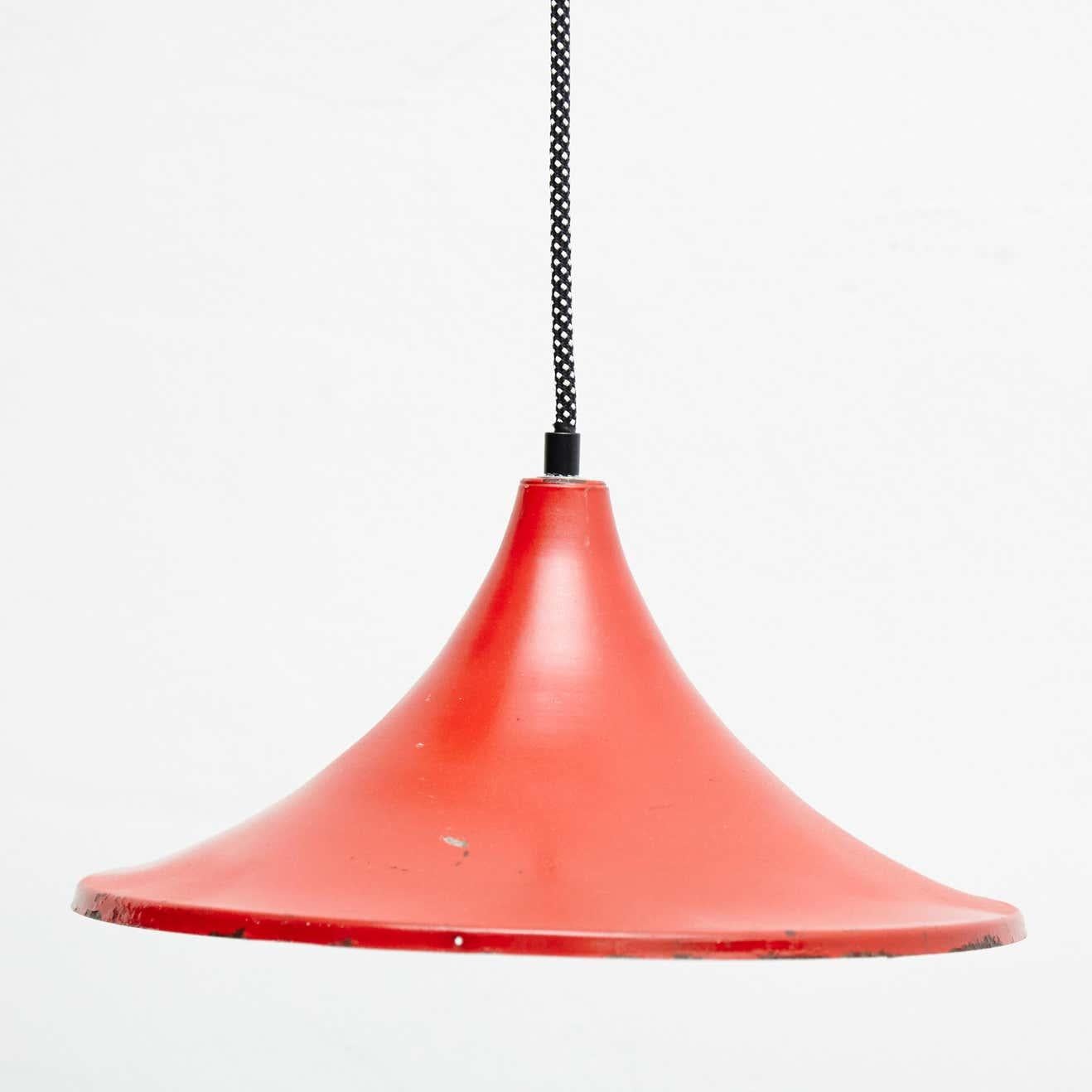 Early 20th century antique red metal ceiling lamp.
By unknown manufacturer, France.

In original condition, with minor wear consistent with age and use, preserving a beautiful patina.

Materials:
Lacquered metal

Dimensions:
ø 32 cm x H 15
