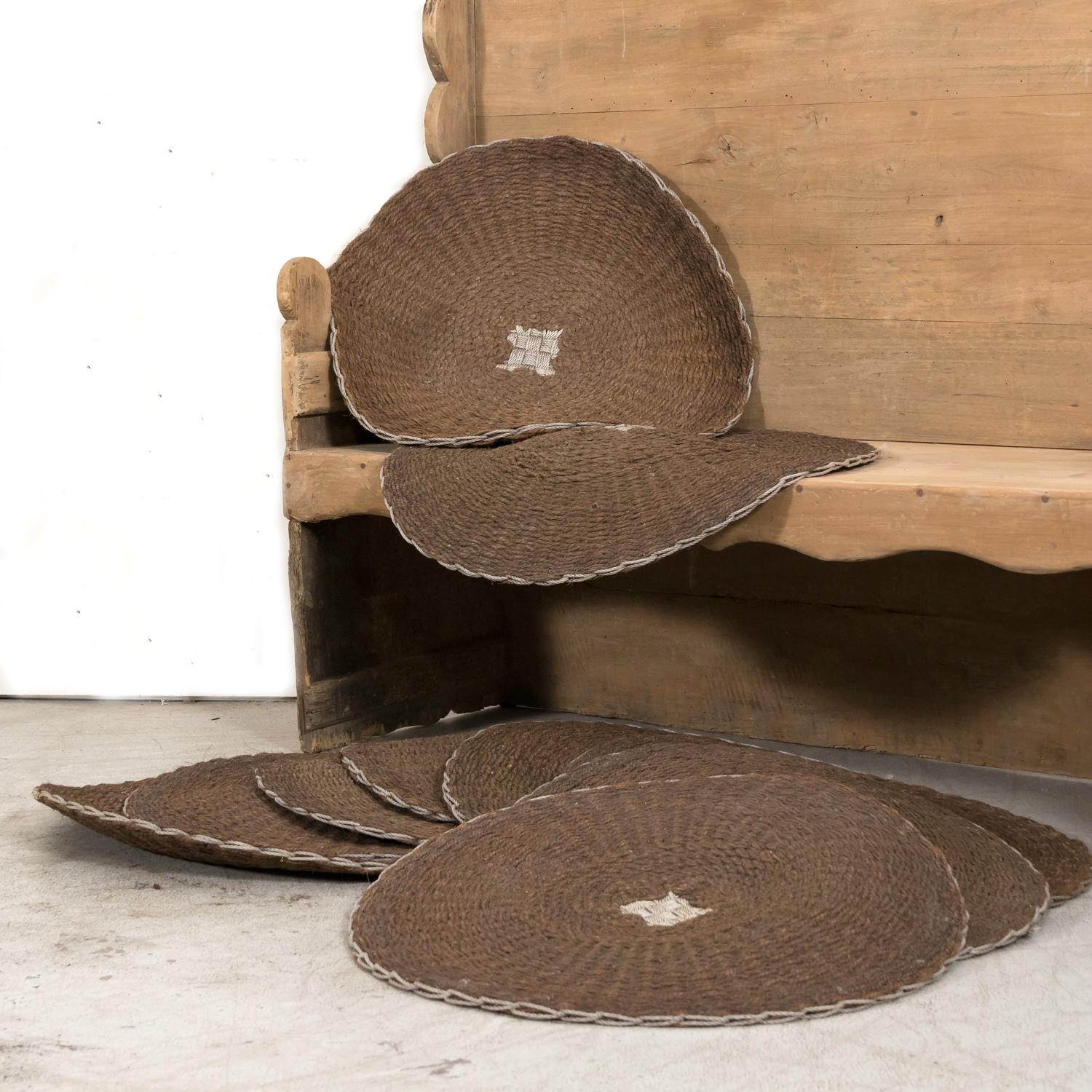 Early 20th century antique French scourtins, circa 1900 to 1930s. These coarse round mats, made from the fibers of coconut shells, were historically used as a filter in Provence's olive presses. Now used as decorative floor mats or wall hangings,