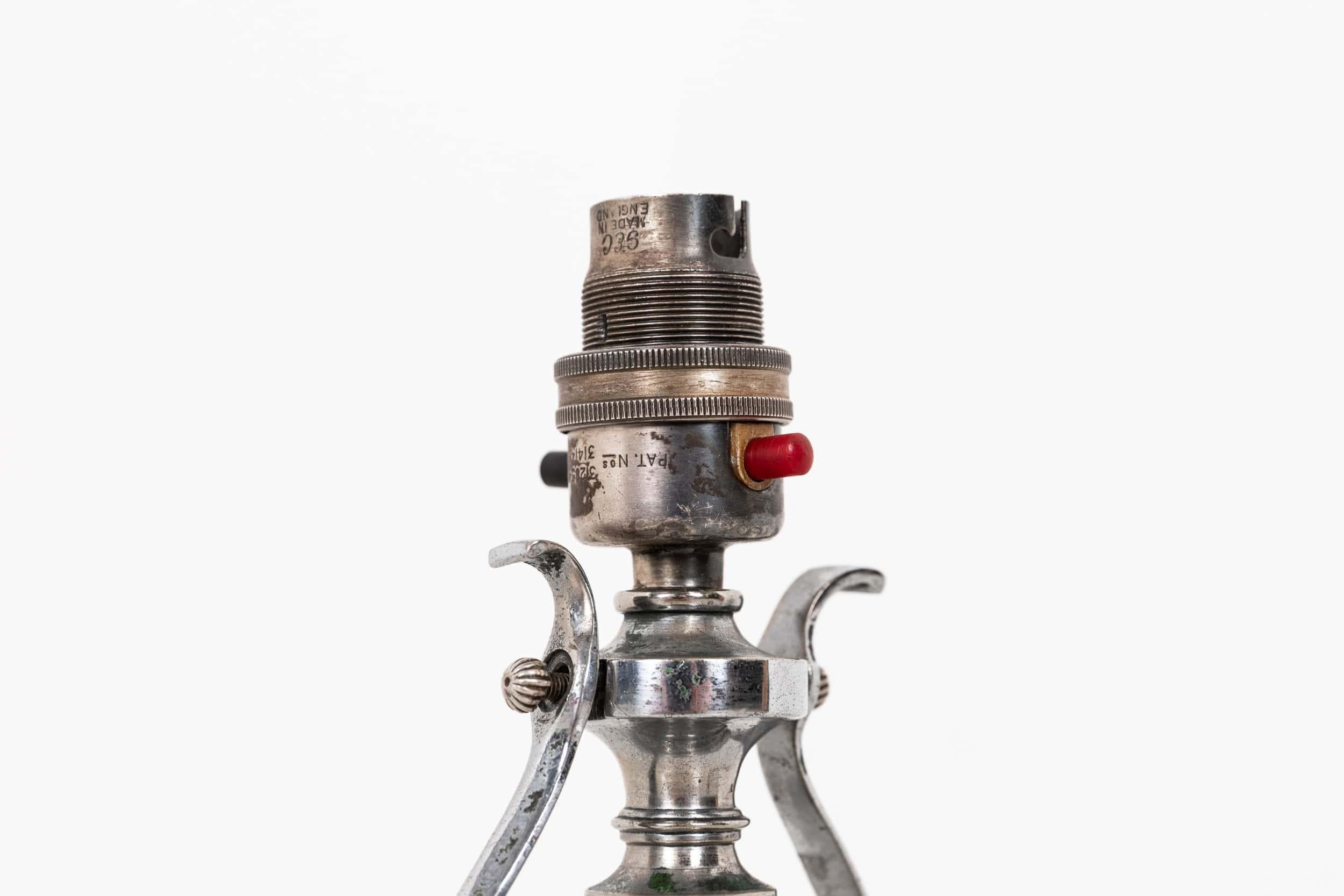 An elegantly formed silver plated brass gimble lamp made in England. c.1910

A high-quality table lamp designed for use on boats, with a simple gimbal mechanism to ensure the light remained level at sea. Presented in original condition with an