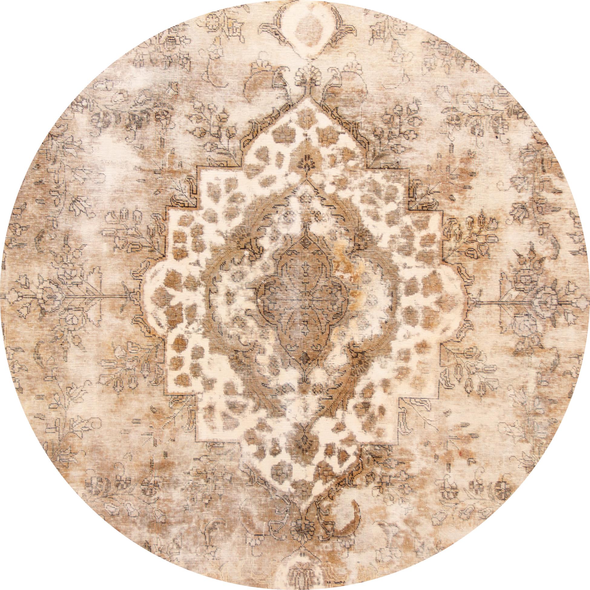 Beautiful antique Tabriz rug, hand knotted wool with a tan field, ivory and brown accents in all-over medallion design.
This rug measures 9' 4