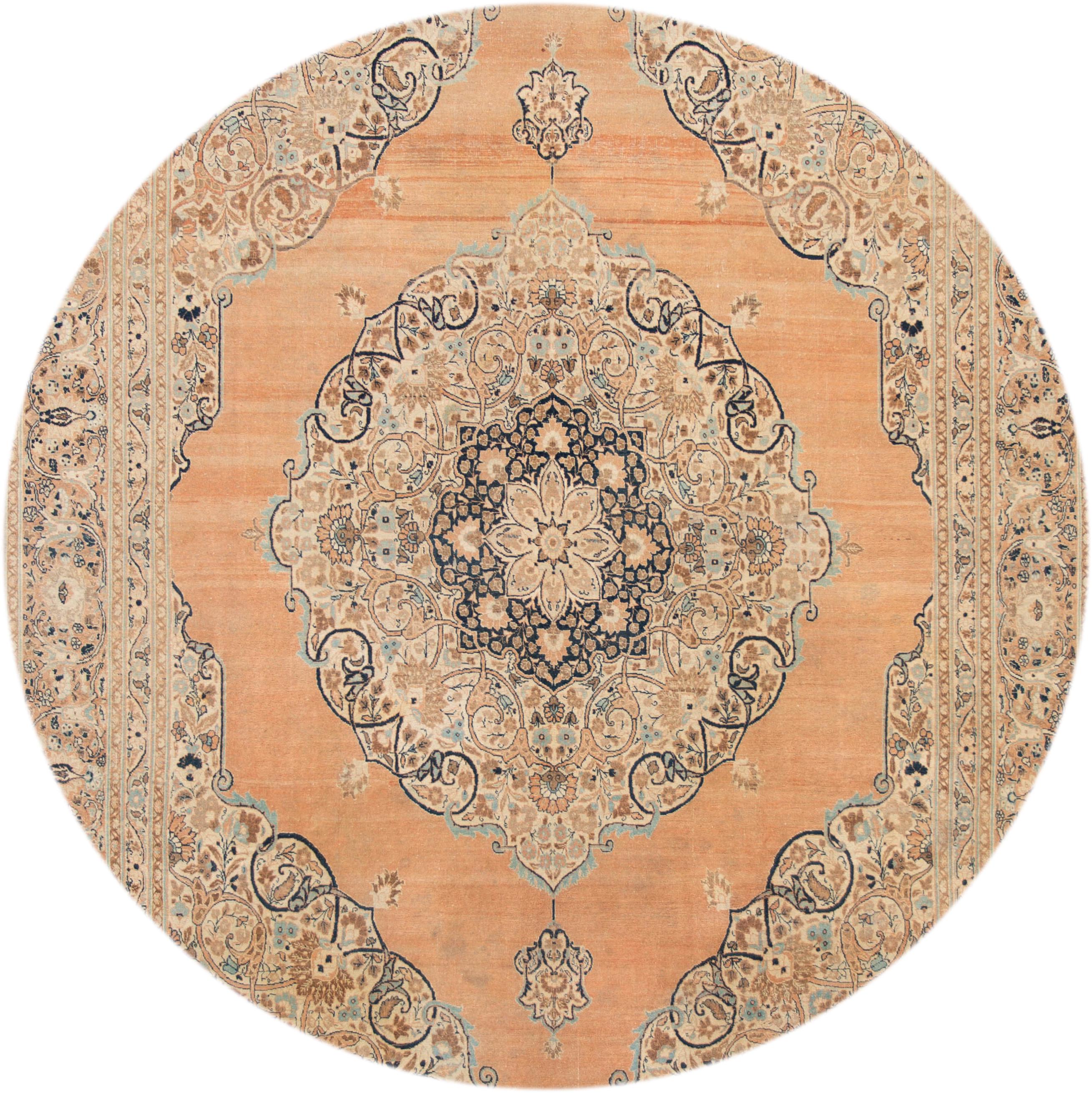 Beautiful antique Persian Tabriz rug, hand knotted wool with a tan field, peach and blue accents in a center medallion design, circa 1900
This rug measures 9' 2