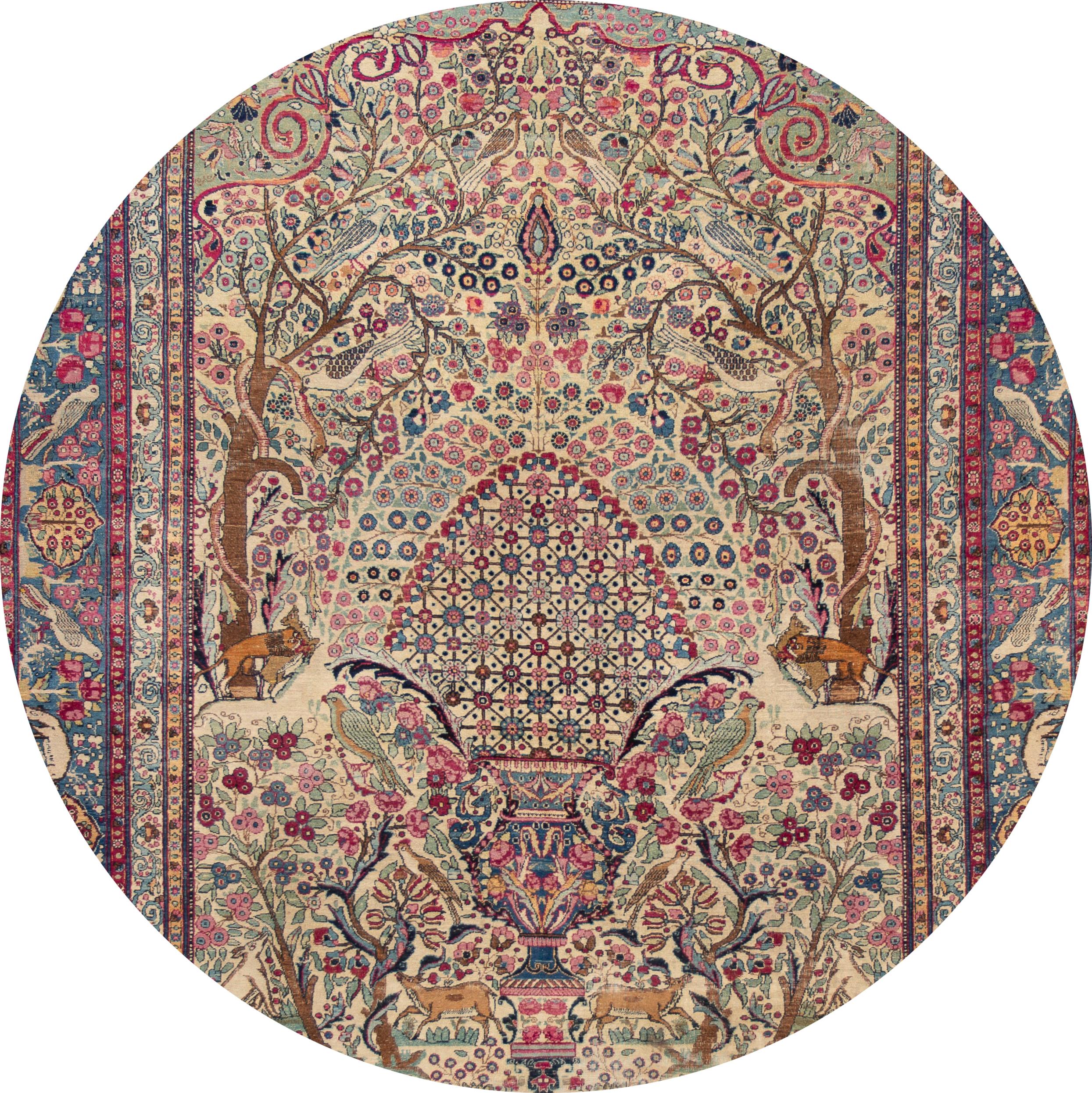Beautiful antique Tehran rug, hand knotted wool with an ivory field, pink and blue accents in an all-over nature pictorial design, circa 1920
This rug measures 7' 4