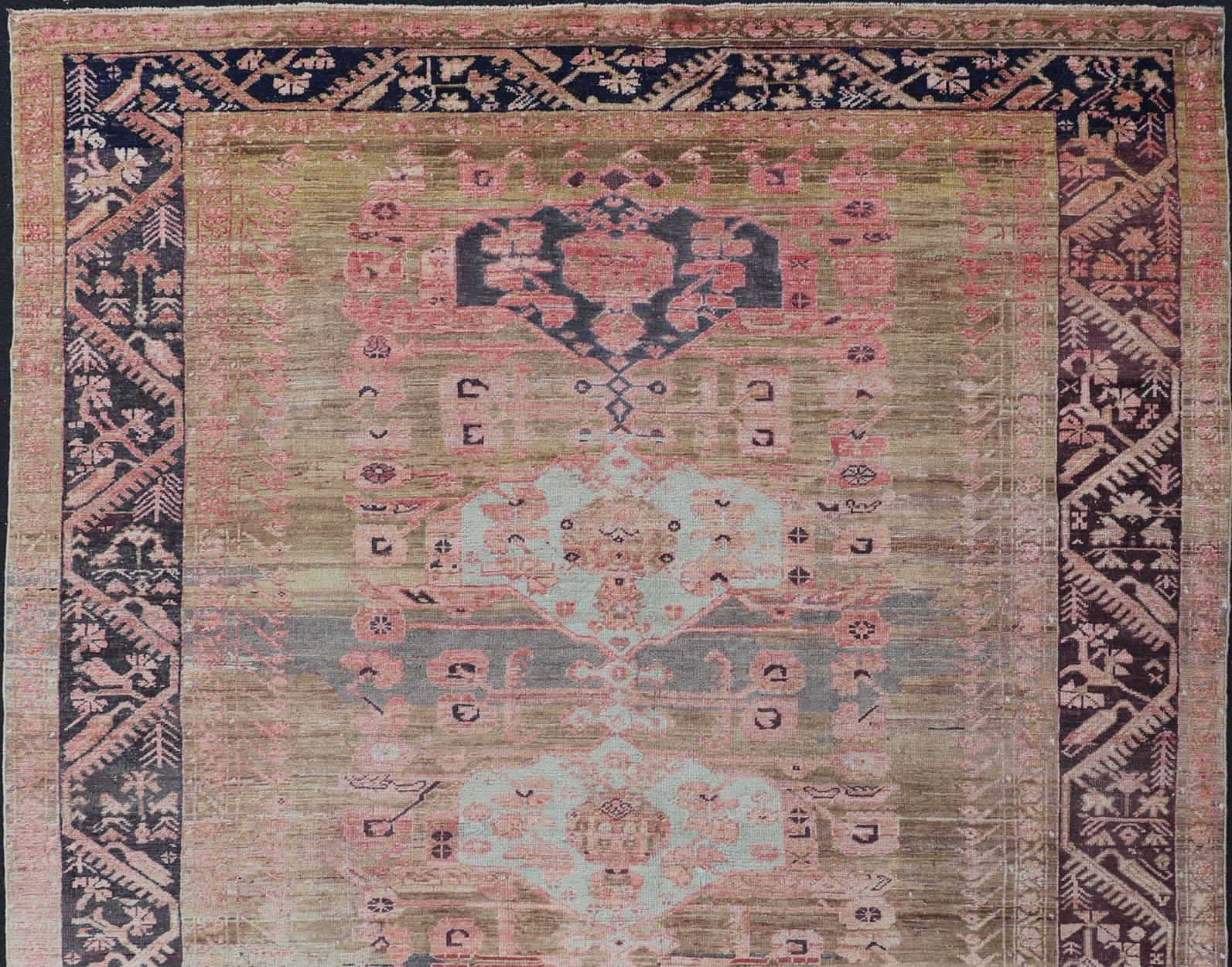 Early 20th century finely woven antique Turkish Oushak rug with abrash/color variation in the center. The background consist of  light Green Background with pink and blue. Keivan Woven Arts rug/EN-179970, country of origin / type: Turkey / Oushak,