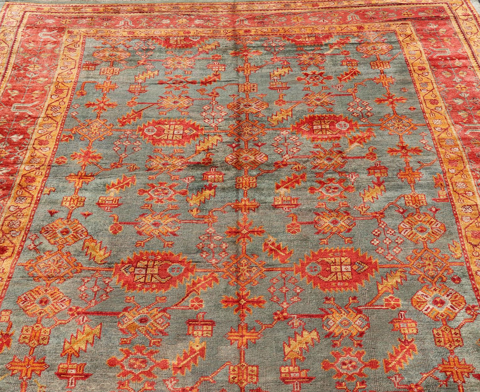 Wool Early 20th Century Antique Turkish Oushak Rug with Flowers and Geometric  For Sale