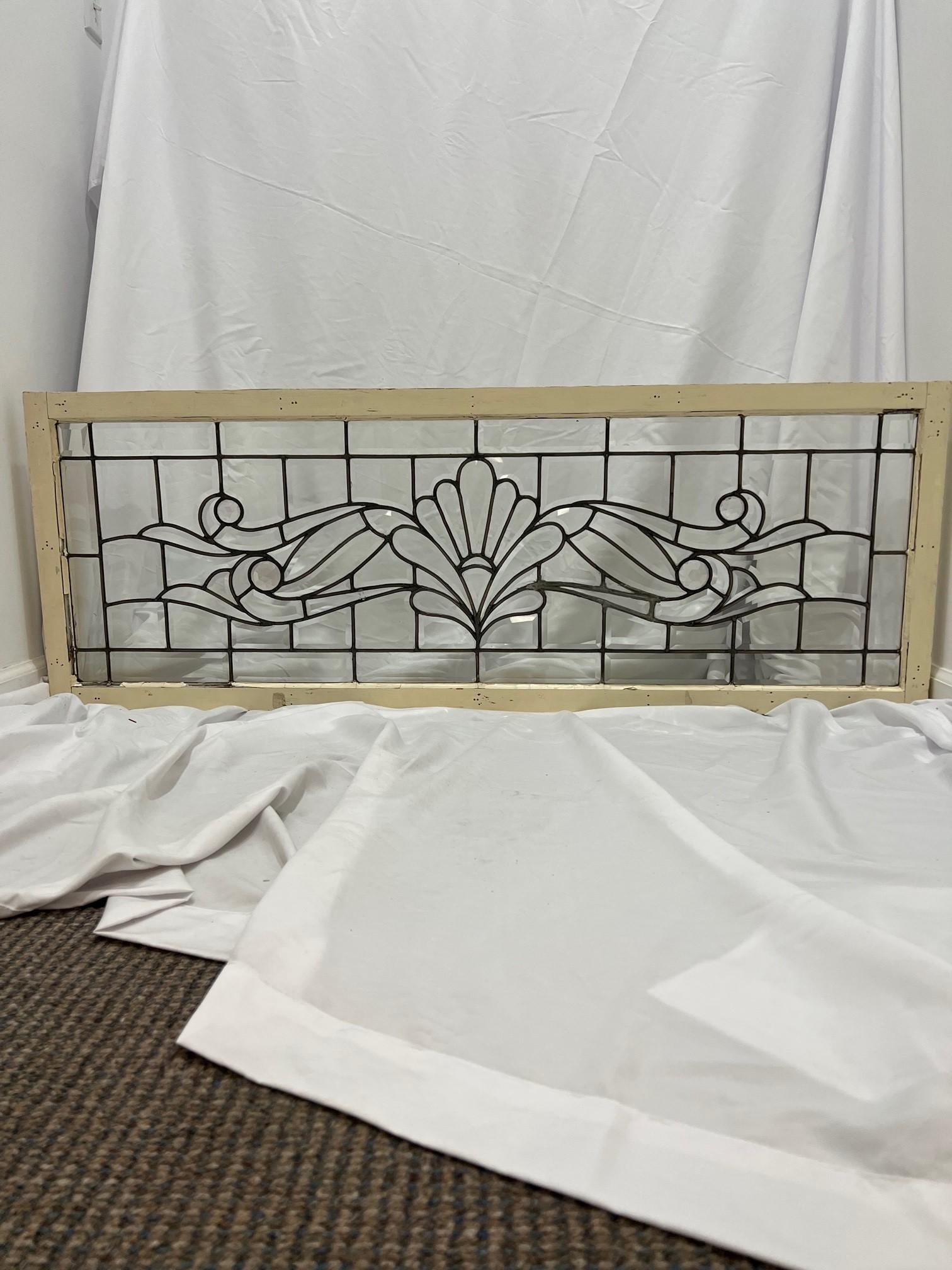 Early 20th century beveled glass transom window with amazing bevels and four jewels. This is a fantastic window from a turn of the century Victorian home in western Pennsylvania. The window is in very good condition with original frame and only has