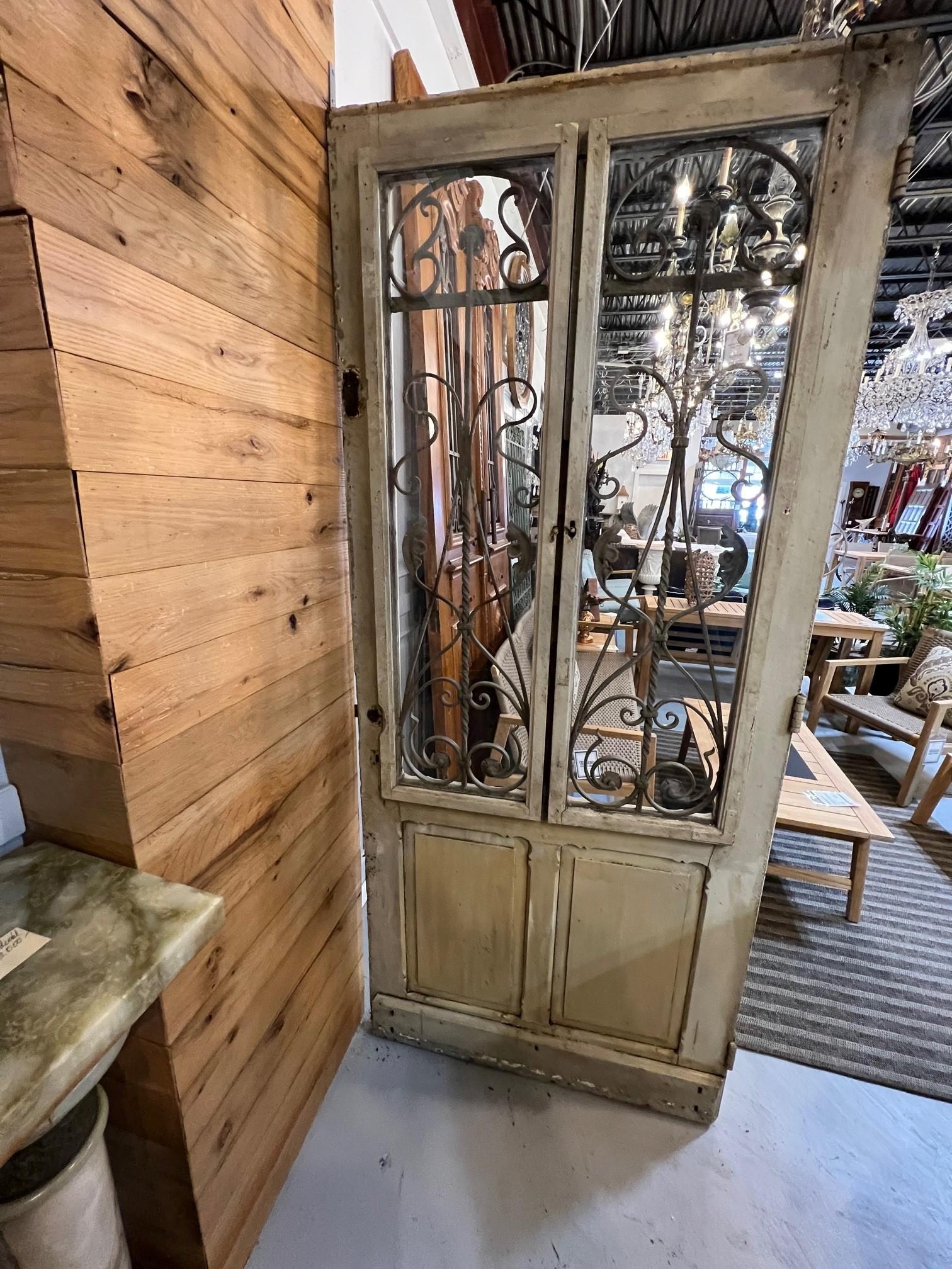 Early 20th Century Antique Wood Door with Iron Panels and Glass Door Panels For Sale 4
