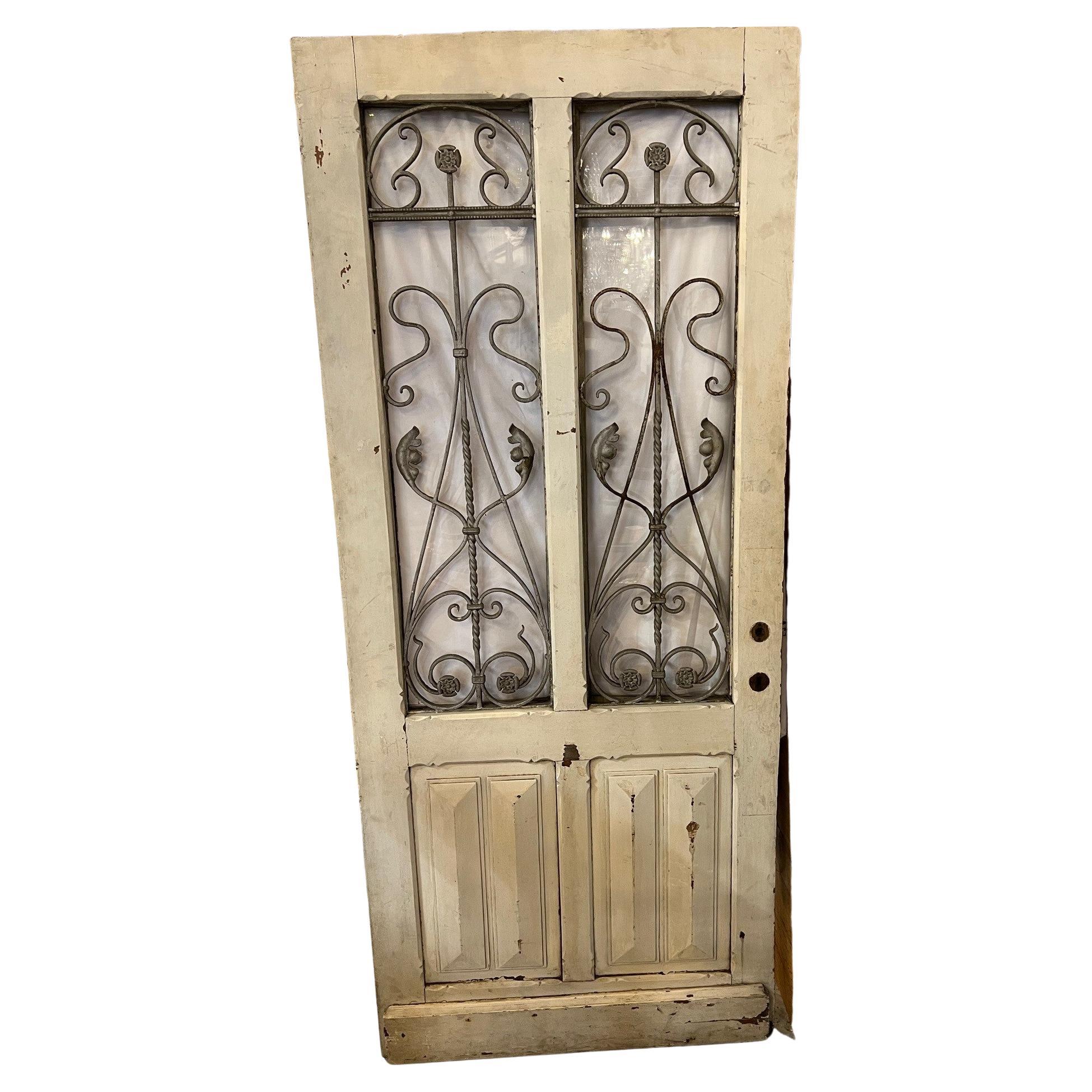 Early 20th Century Antique Wood Door with Iron Panels and Glass Door Panels For Sale