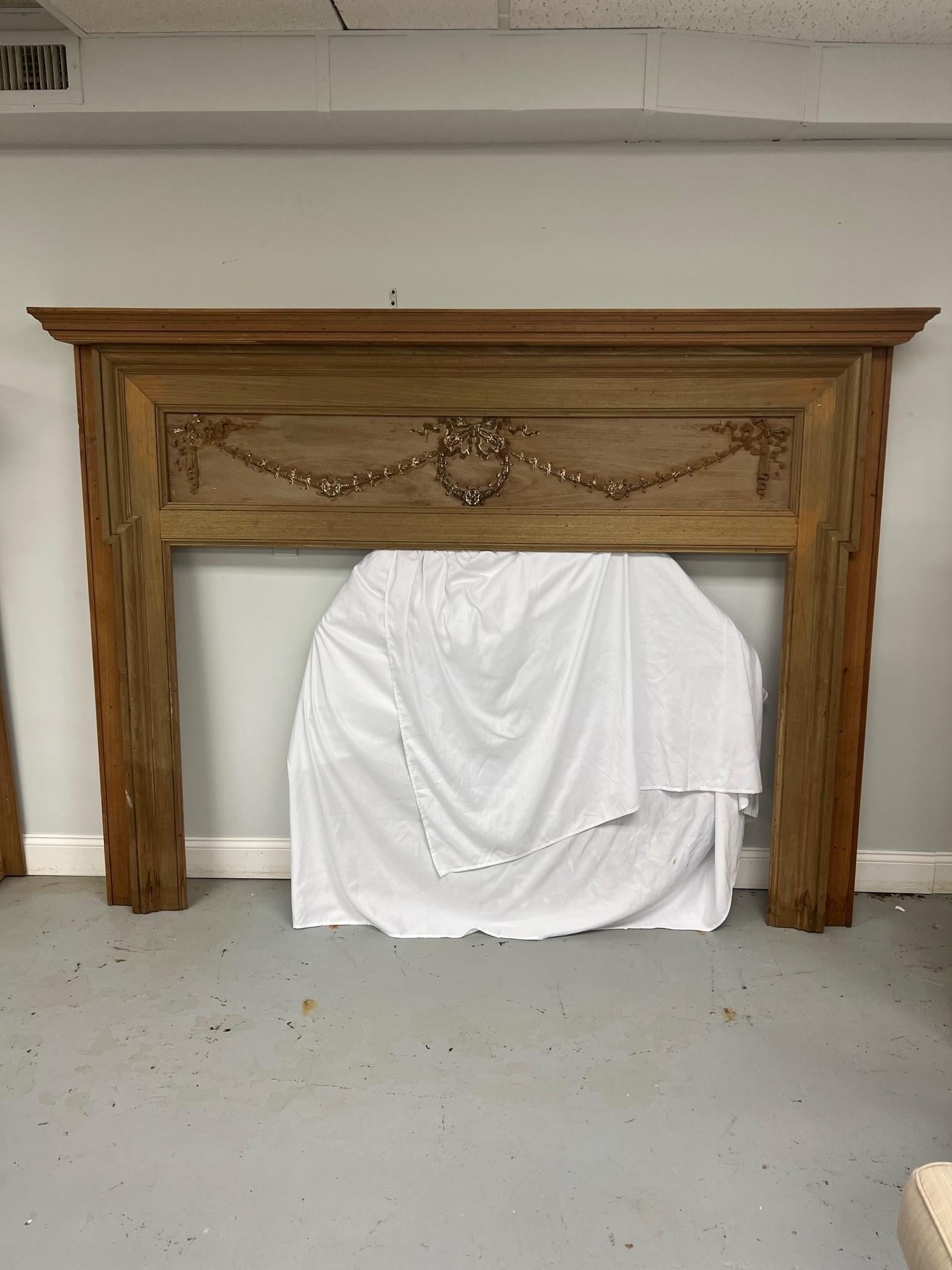 Early 20th century antique wood fireplace mantel with a carved wood center panel. Its hard to tell but I believe the panel is older than the mantel and the mantel was built around the panel many years ago. Salvage from an estate in Western PA. this