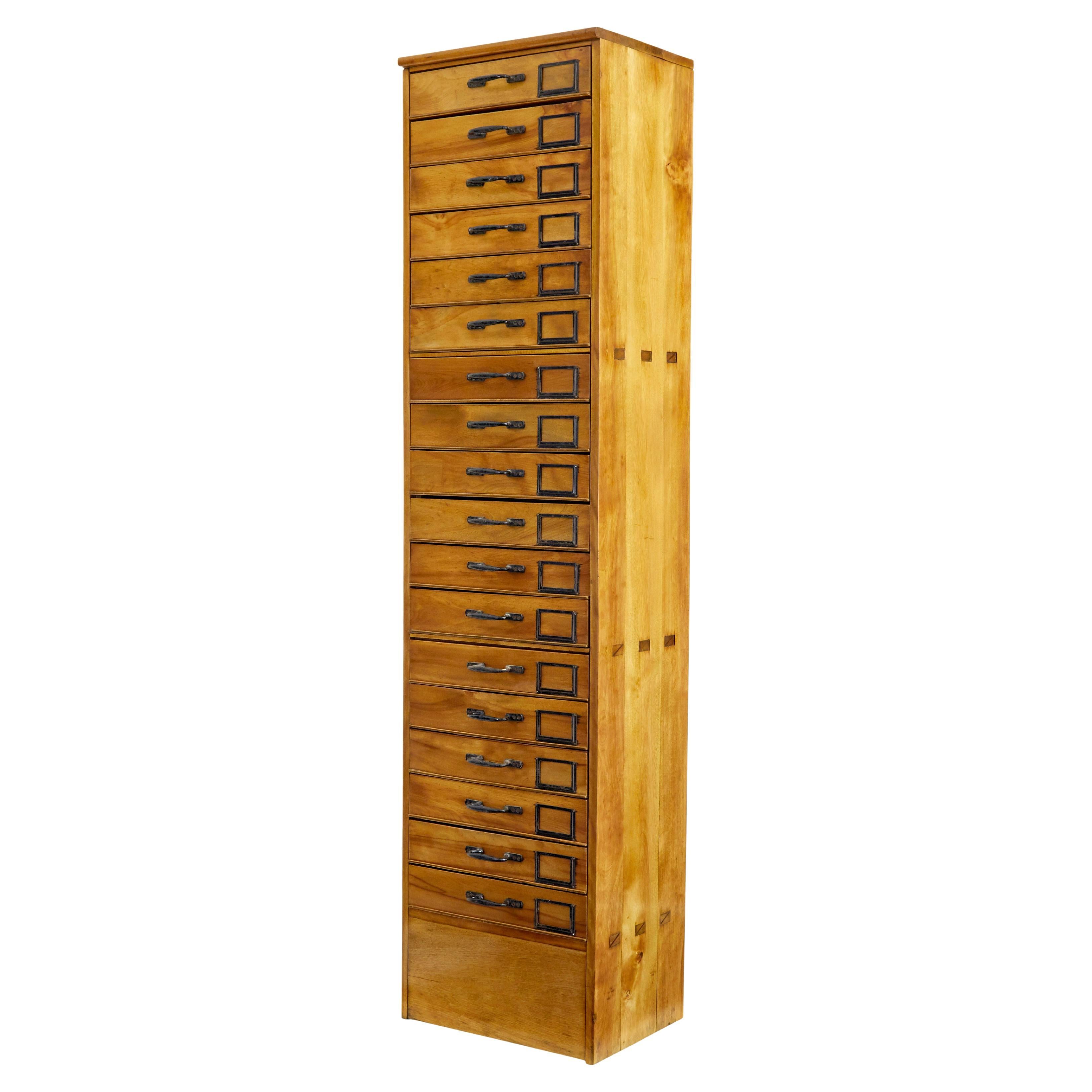 Early 20th century apothecary fruitwood tall chest of drawers For Sale