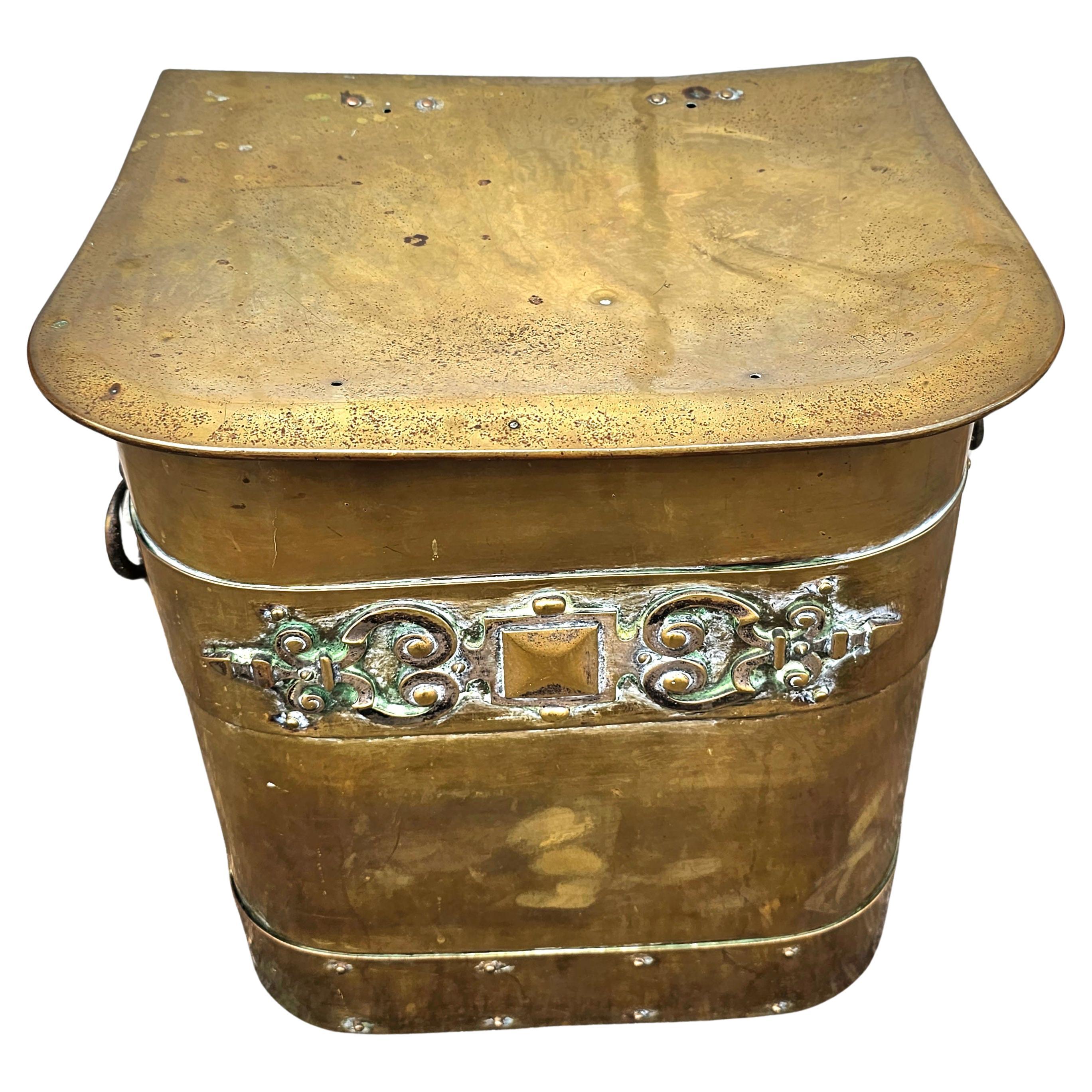 An Early 20th Century Art Deco Brass Fireplace hinged covered top Fuel Bucket with iron double lined. Measures 15