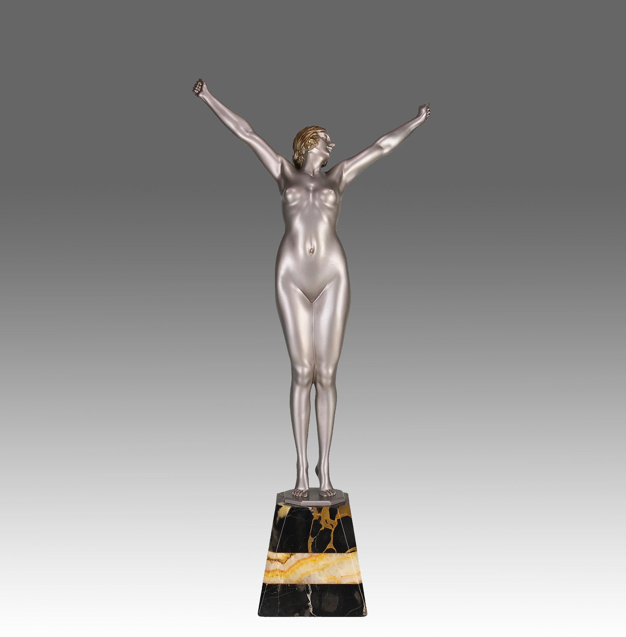 Enchanting early 20th Century Art Deco  cold painted silver bronze figure of a standing woman holding her arms high above her in a stretched pose, exhibiting excellent colour and fine detail. Raised on a shaped portoro marble base and signed D H