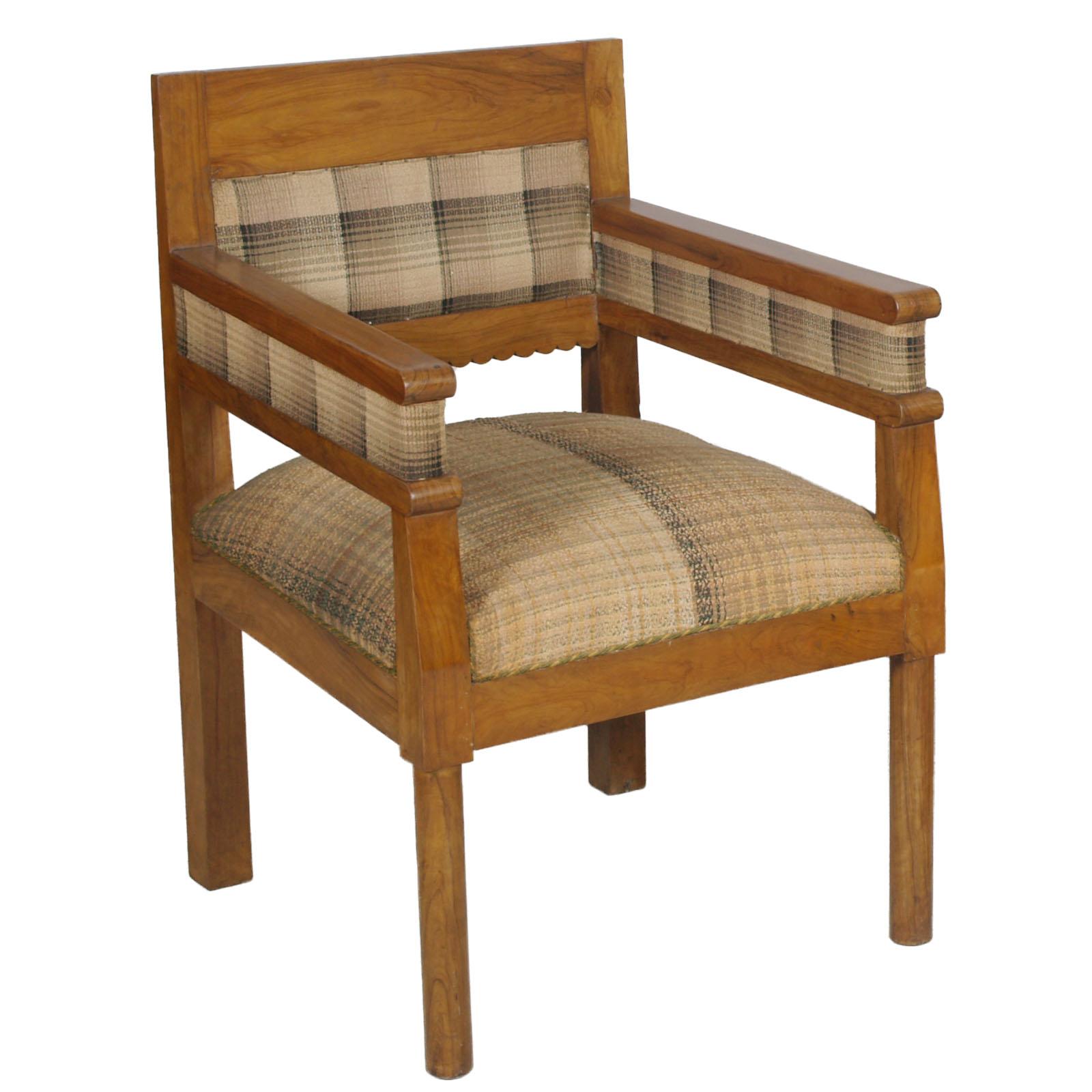 1920s Pair of precious Art Deco armchairs in solid olive wood with original raw fabric. The fabric of one armchair, has an original patch, which,  embellishes the look. 
Spring seat
This pair of armchairs, comes from an ancient residence on Lake