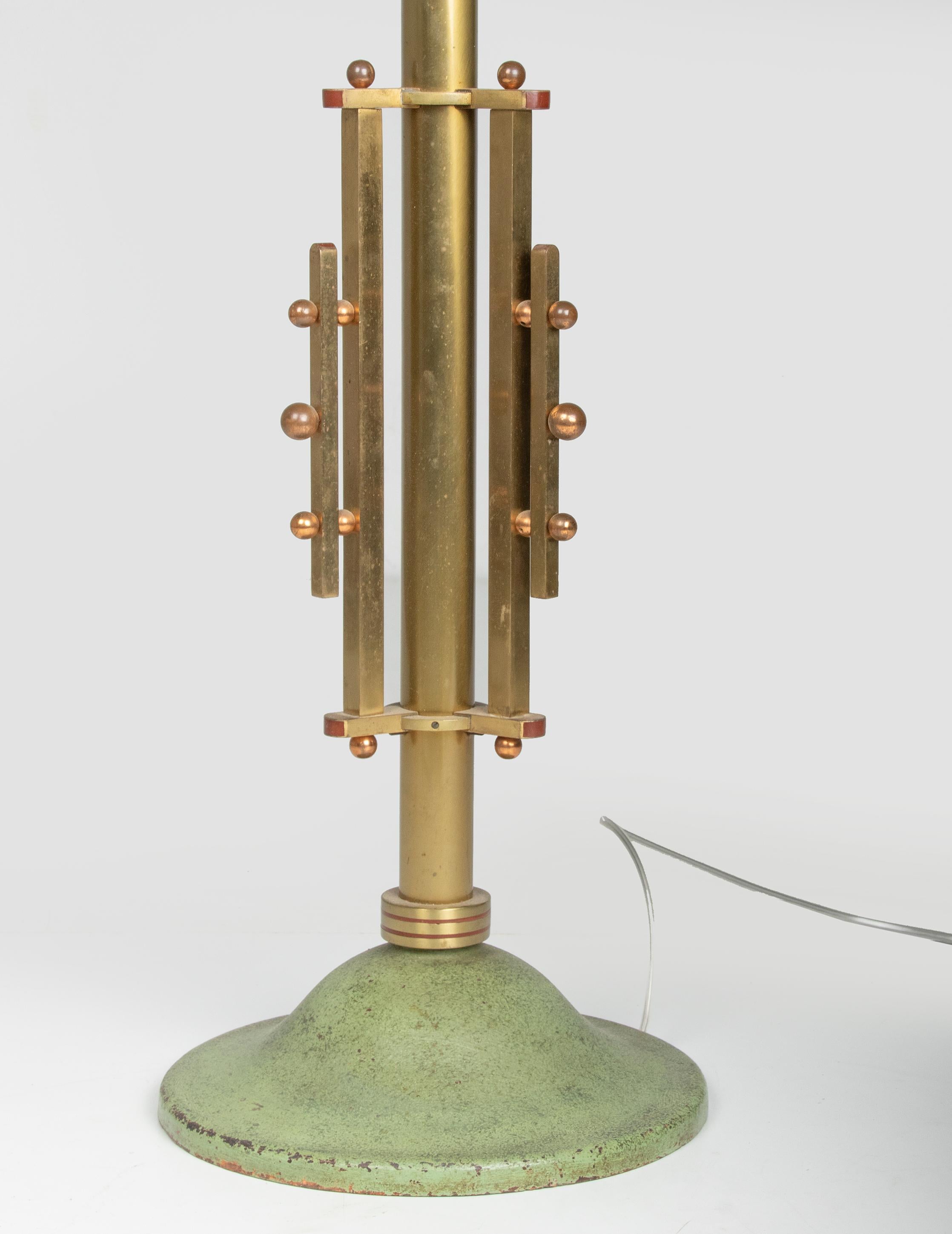 Beautiful Art Deco floor lamp from the Belgian brand Erpe. The lamp has a cast iron base, patinated in a green colour. The trunk is made of copper and has a beautiful golden glow. The bowl on top is made of aluminum, patinated in the same green