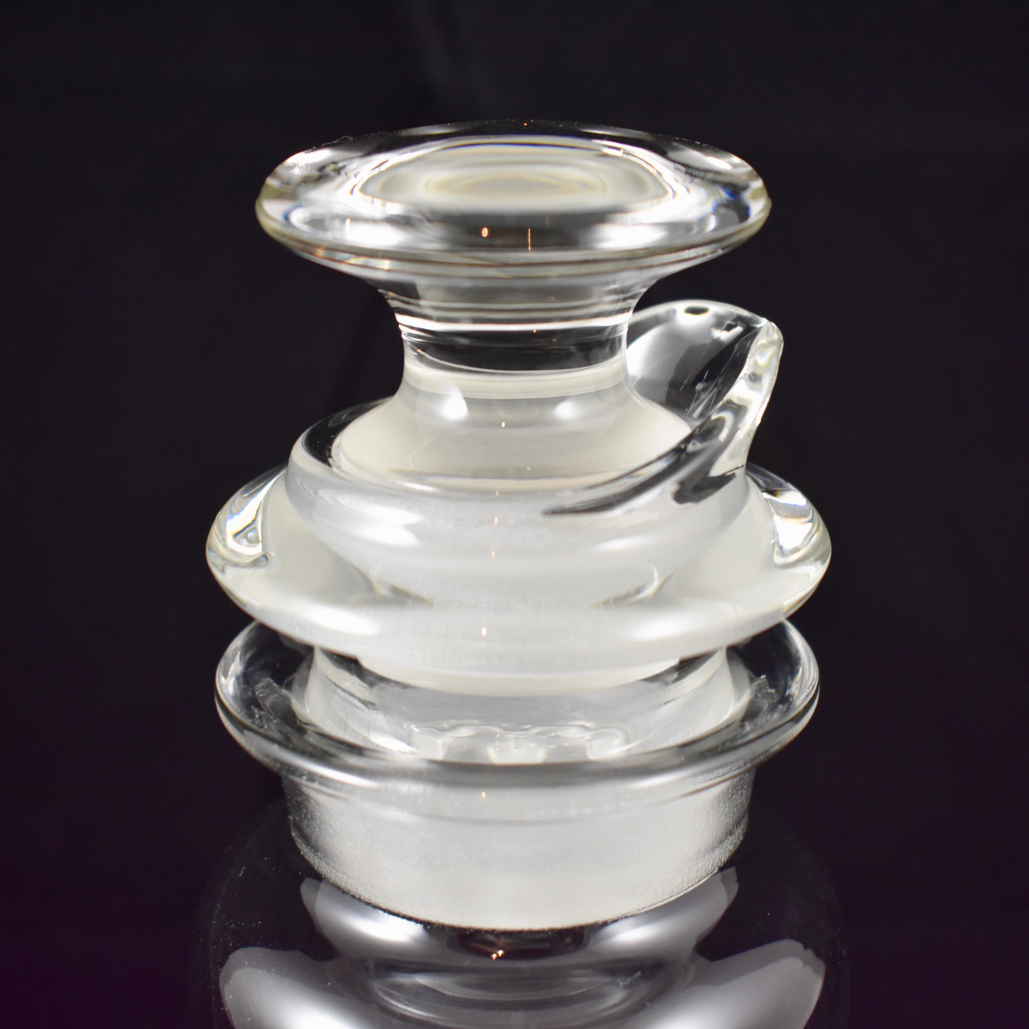 An Art Deco period, Heisey cut glass three-piece cocktail Shaker, circa early 20th Century. 

The neck of the Shaker holds an inset pourer formed with a strainer which then holds the stopper. All three pieces are ground for a tight fit when