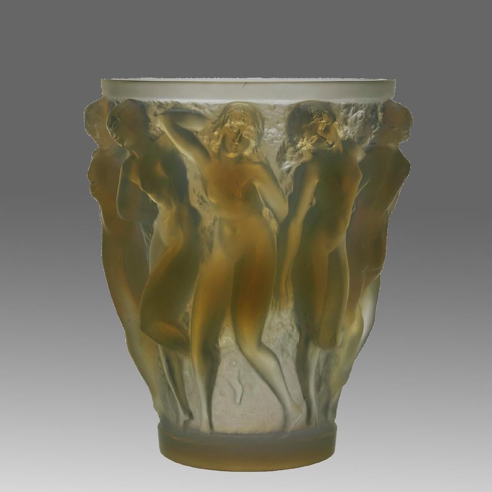 A superb René Lalique original Art Deco glass vase decorated with dancing bacchantes in various poses and pairings around the full circumference of the vase, exhibiting an excellent mix of frosted and opalescent glass with fine hand finished detail,