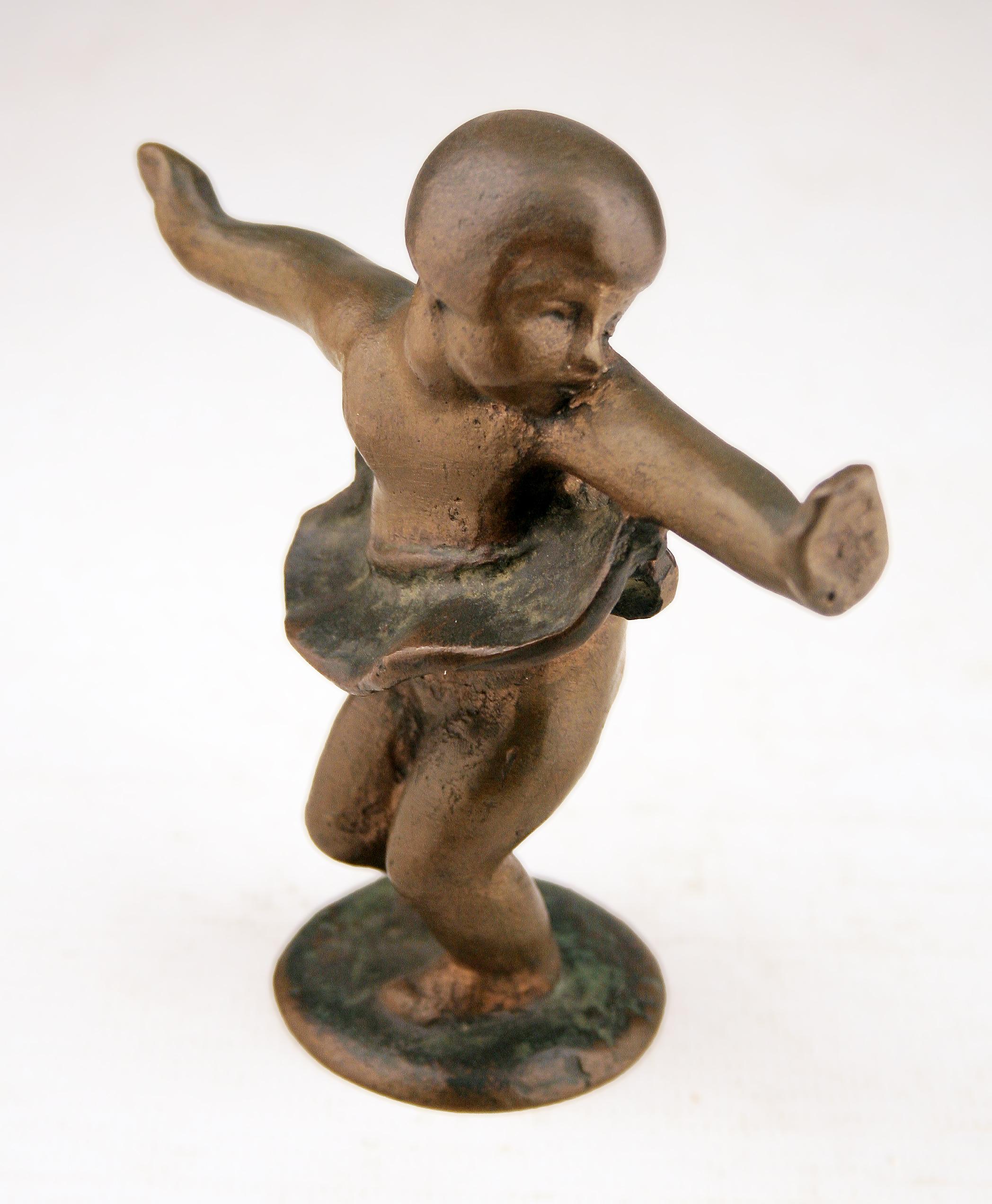 Early 20th century Art Déco small bronze sculpture of girl with skirt dancing

By: unknown
Material: bronze, copper, metal
Technique: patinated, cast, molded, metalwork
Dimensions: 2 in x 5 in x 4 in
Date: early 20th century
Style: Art Déco
Place of
