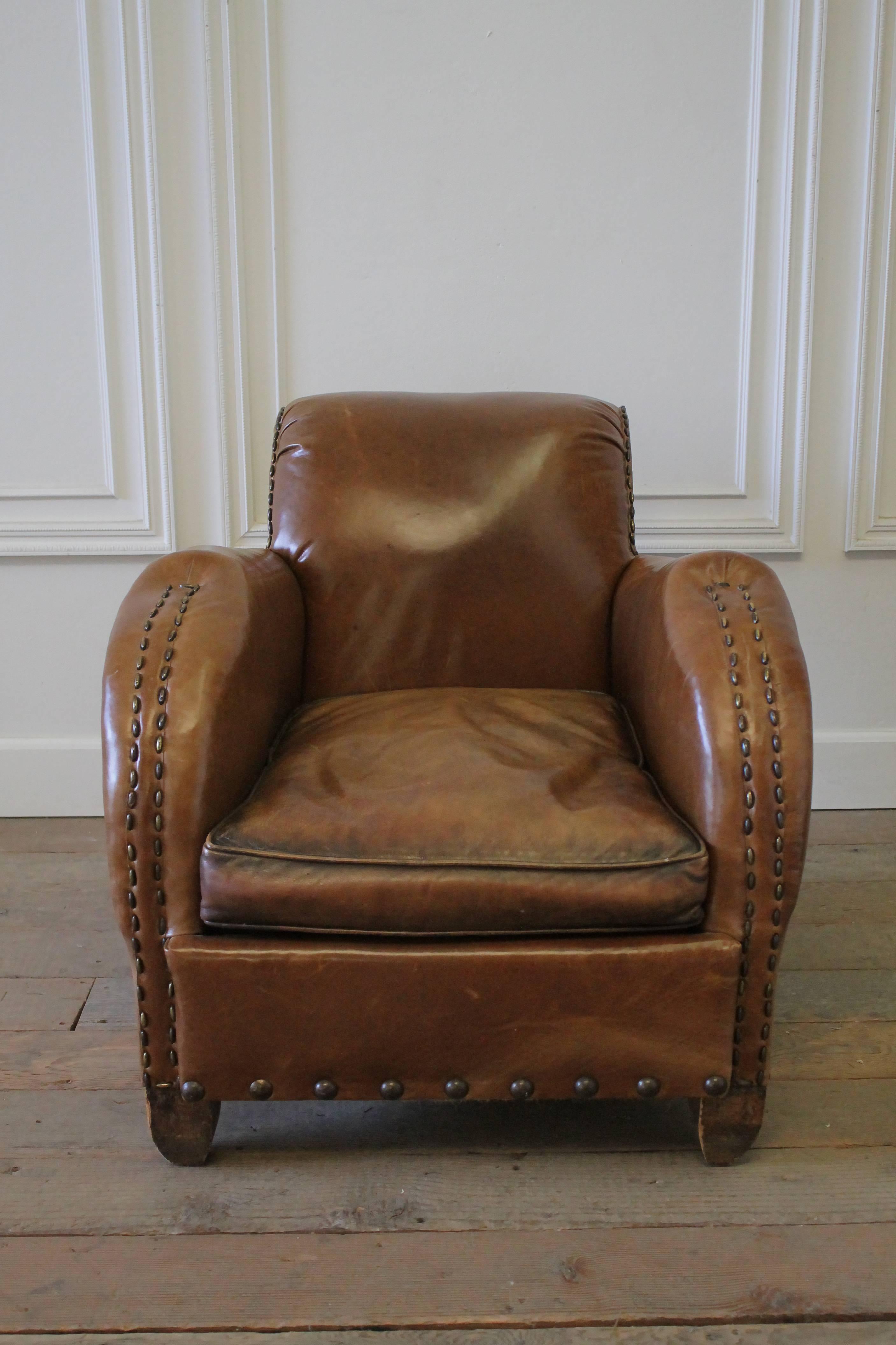 Early 20th century Art Deco style French leather club chair
Seat has feather and down stuffing. Original nailhead trim. Very comfortable.
Leather is not original, it has been redone. Vintage style leather that shows scratches and