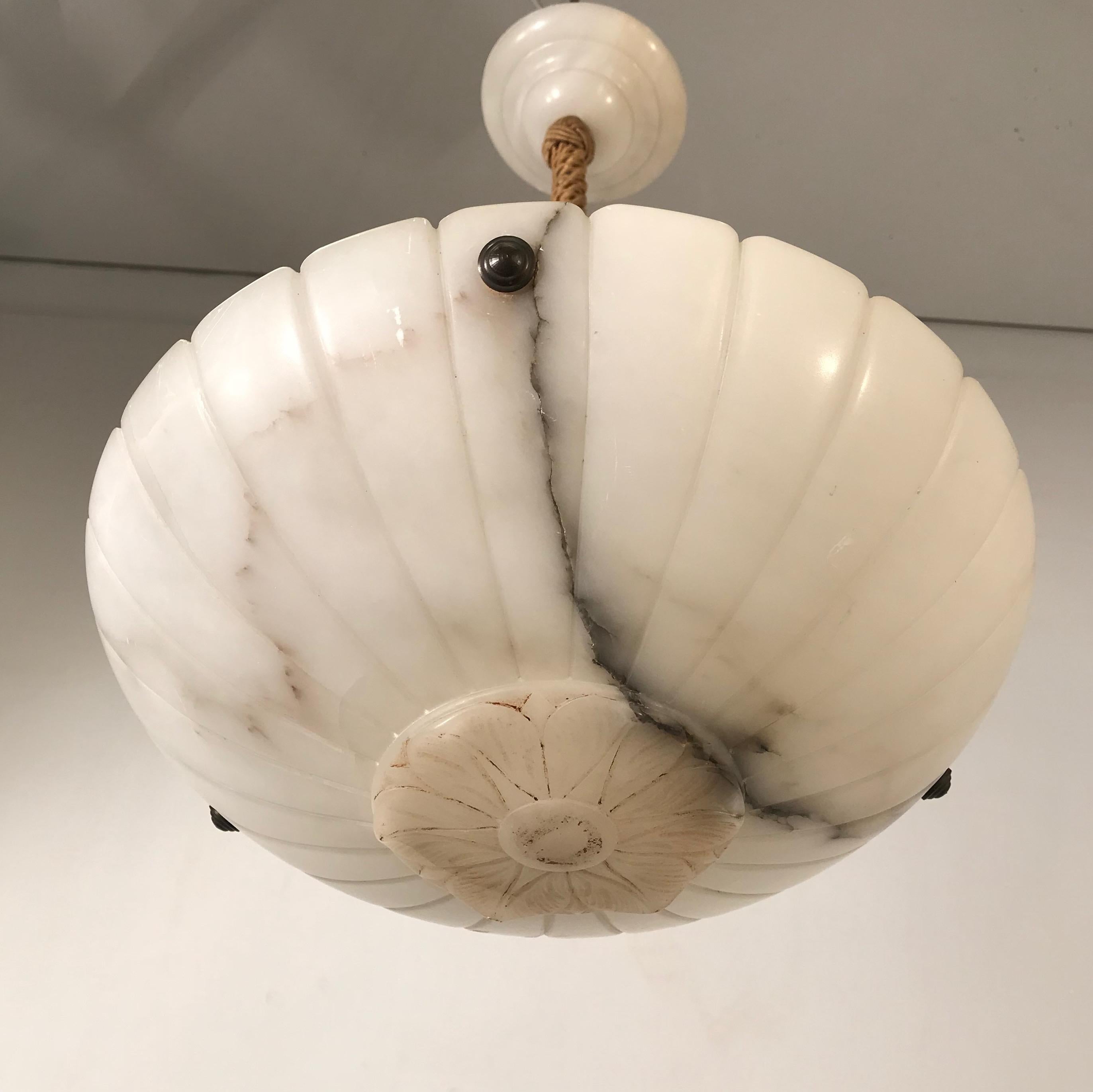 Great shape and small size alabaster pendant with original alabaster canopy & rope.

If you are looking for a small, elegant and great condition alabaster pendant then this classical design light fixture could be perfect for you. This hand-carved