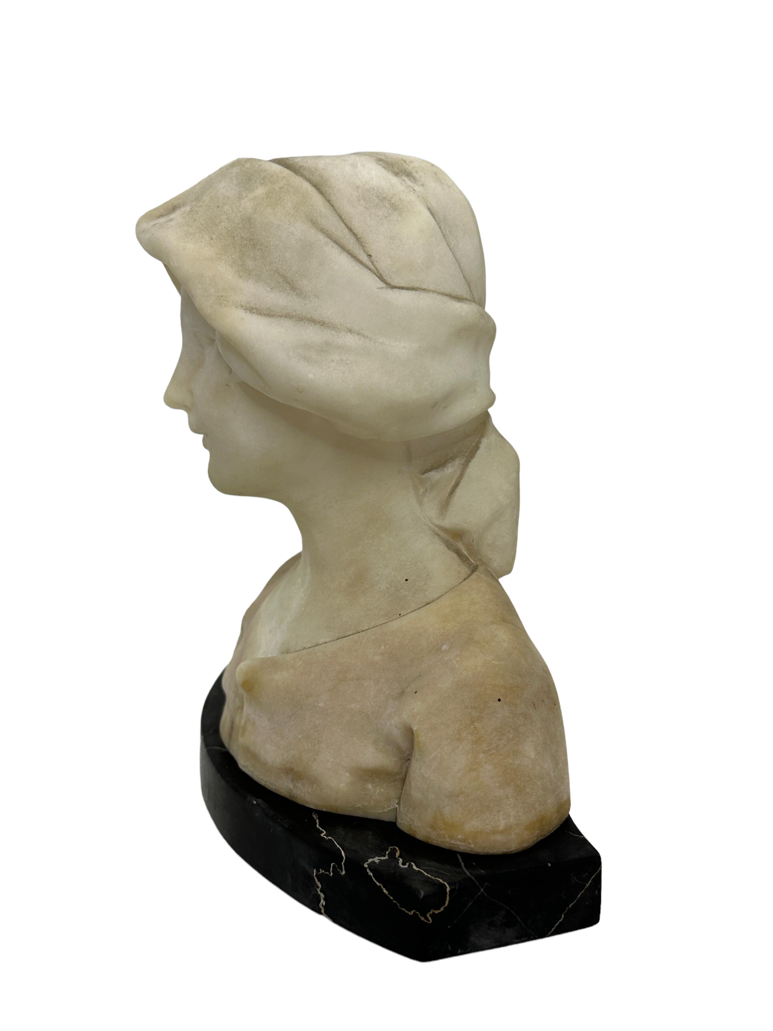 Beautiful Art Nouveau white marble (Alabaster) girl bust, on a black marble base. 